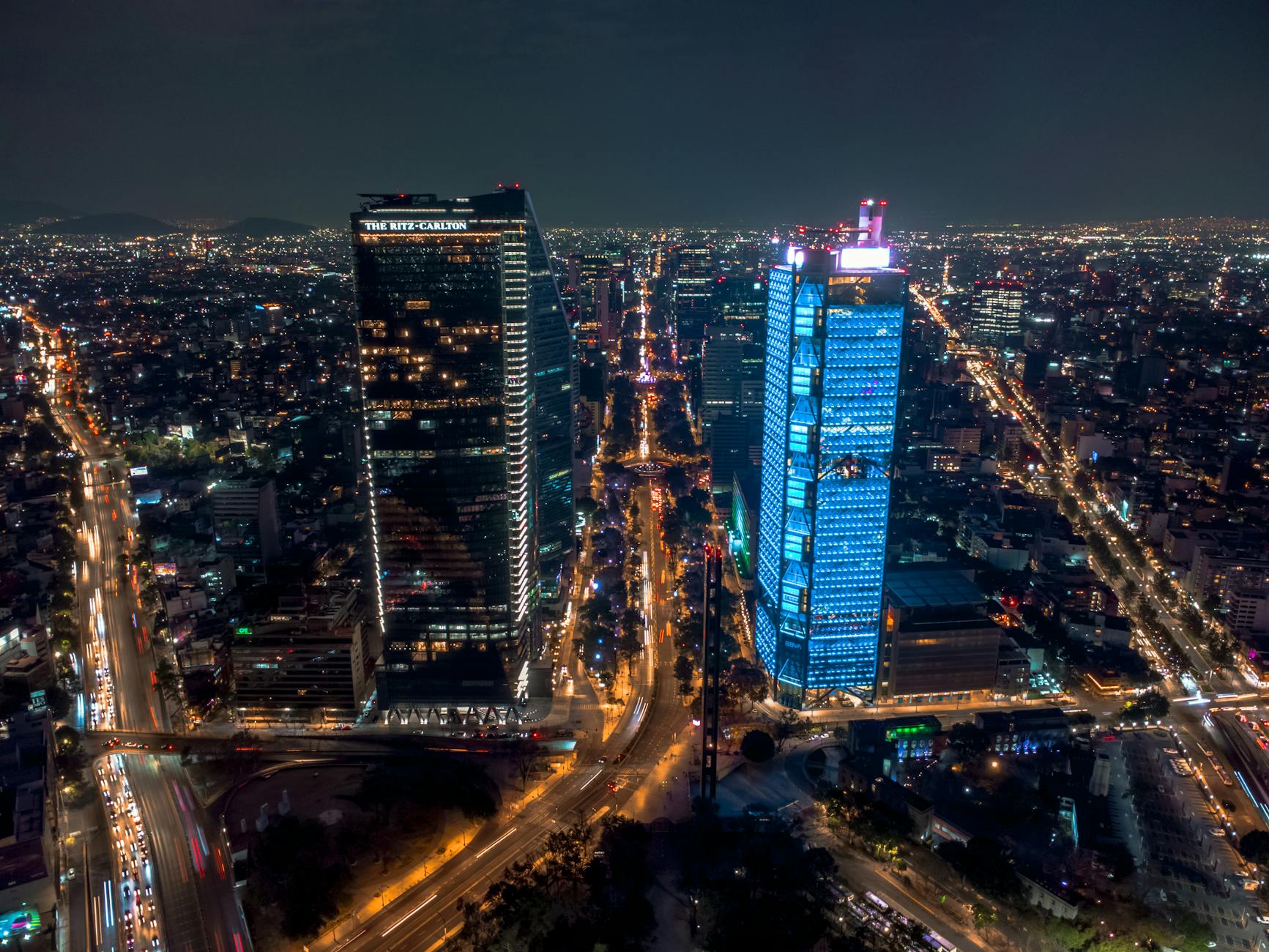 Aerial night view of illuminated skyscrapers in Mexico City