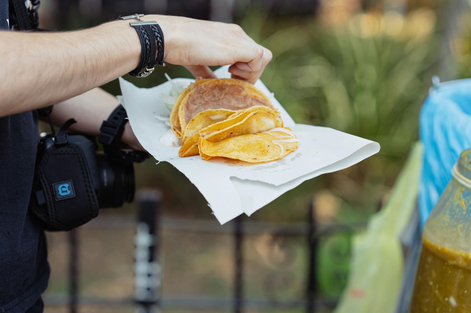 Person holding tacos from a Mexico City street vendor