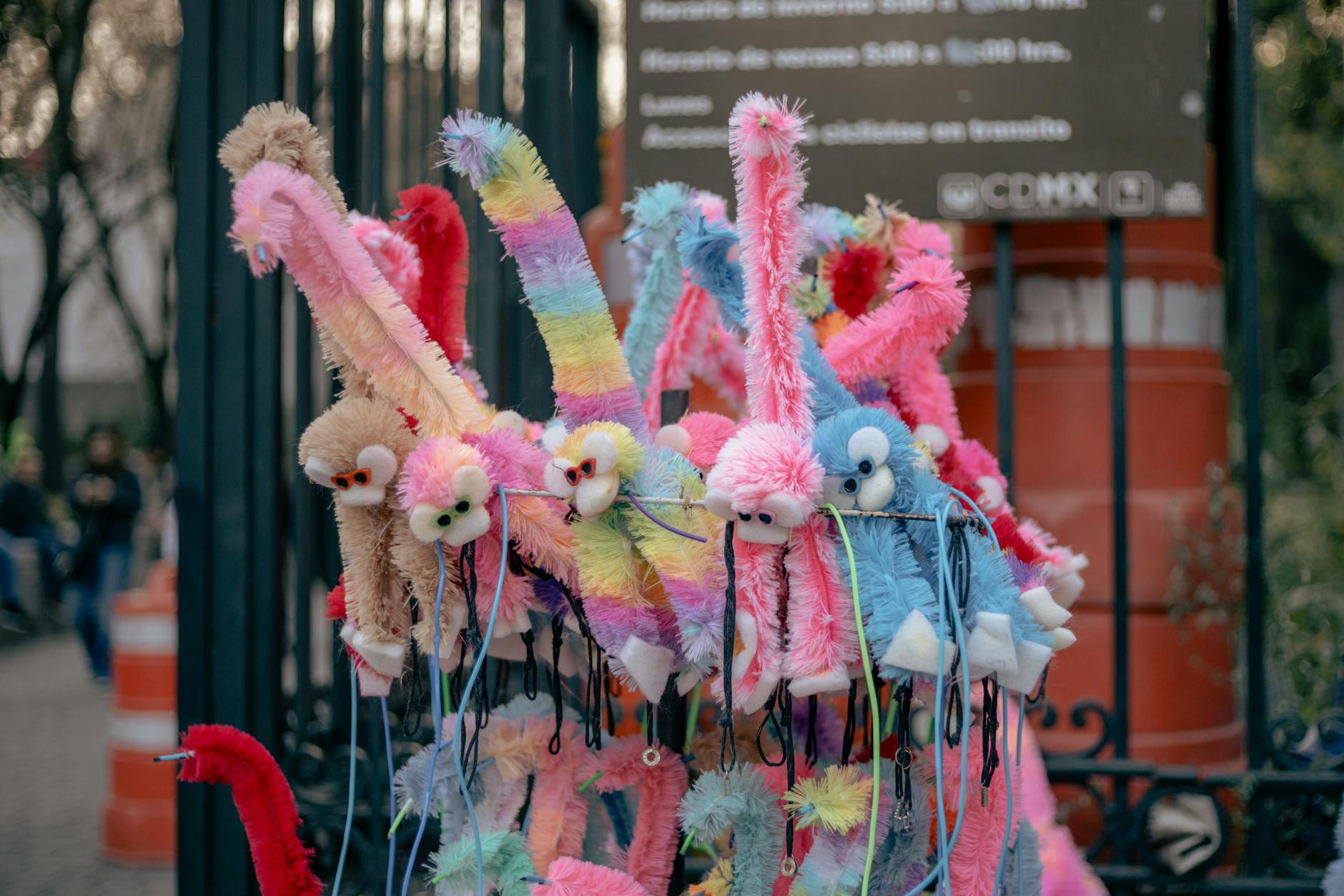 Colorful stuffed animal toys at an outdoor stall in Mexico City