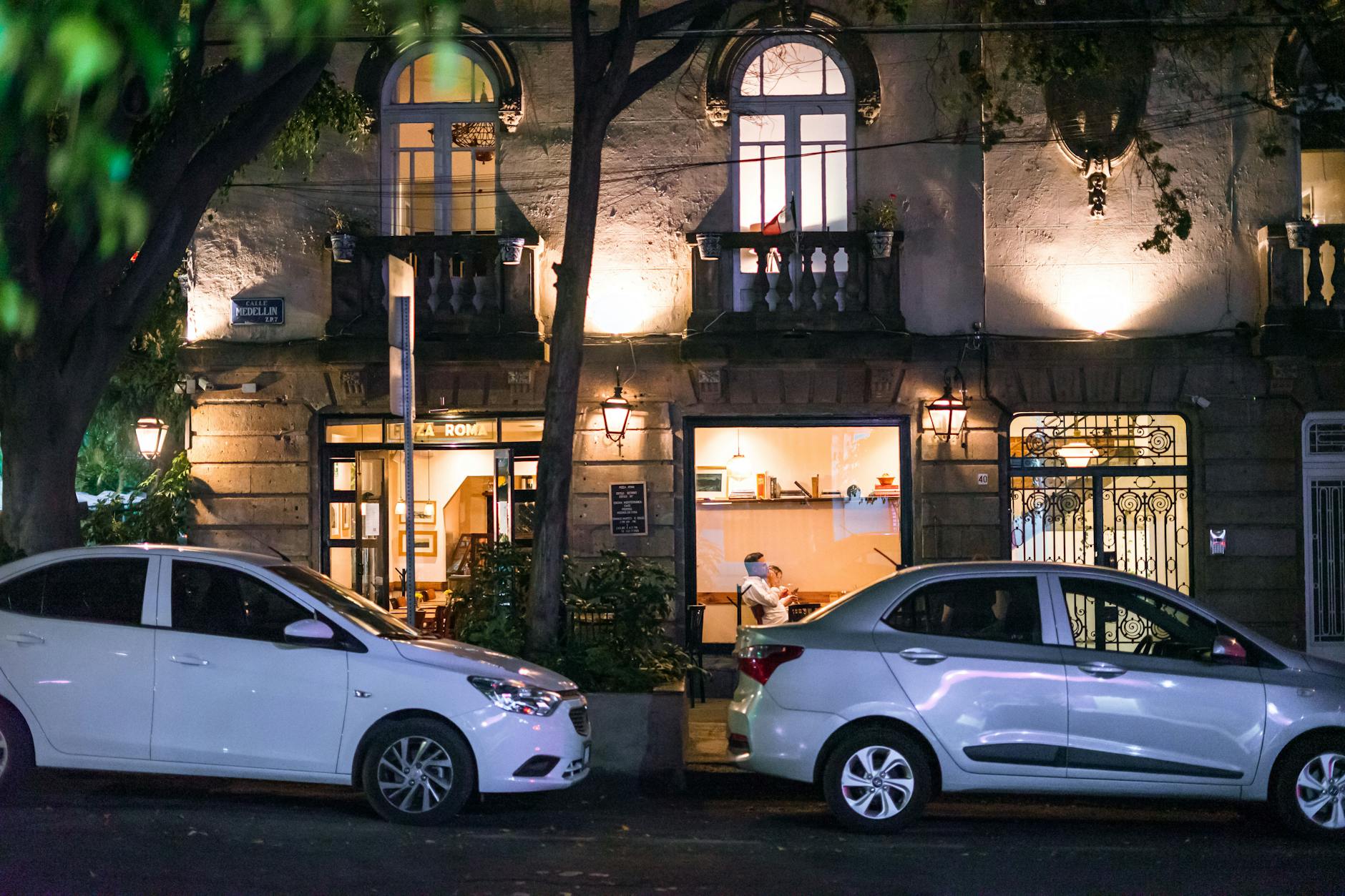 Quiet cafe street scene in Mexico City at night