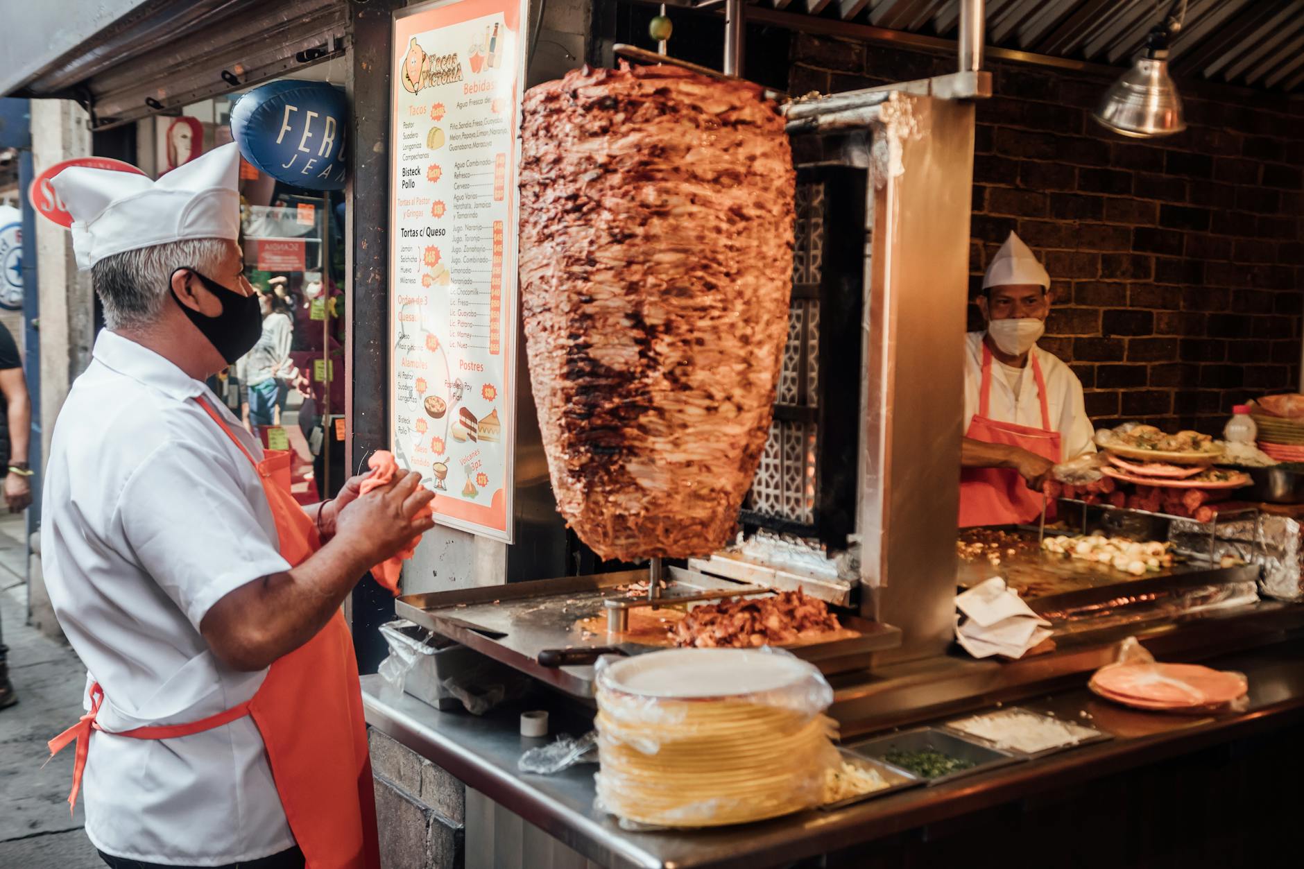 Taco vendors serving tacos al pastor on a Mexico City street