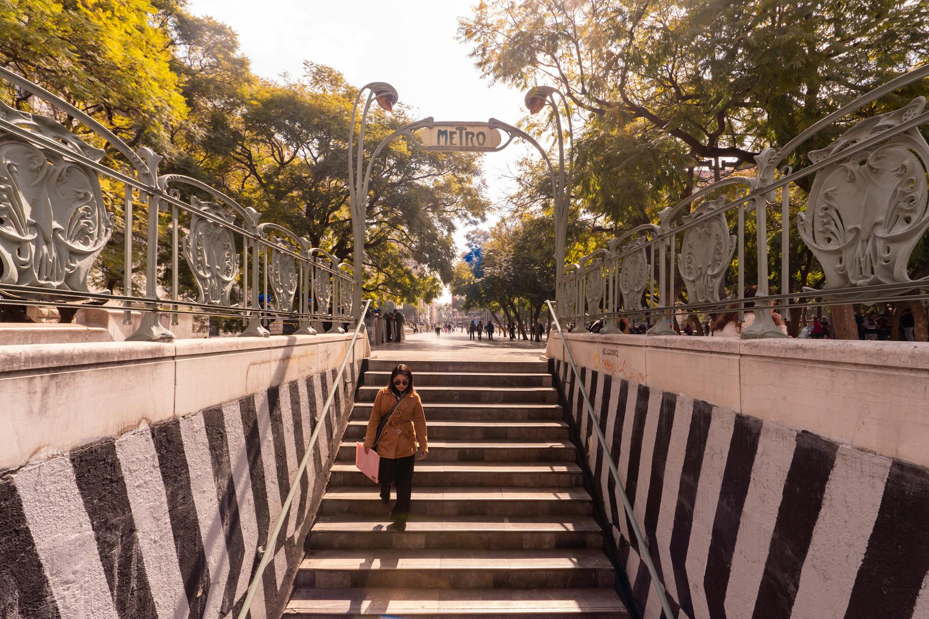 Ornate Metro entrance on a busy Mexico City street