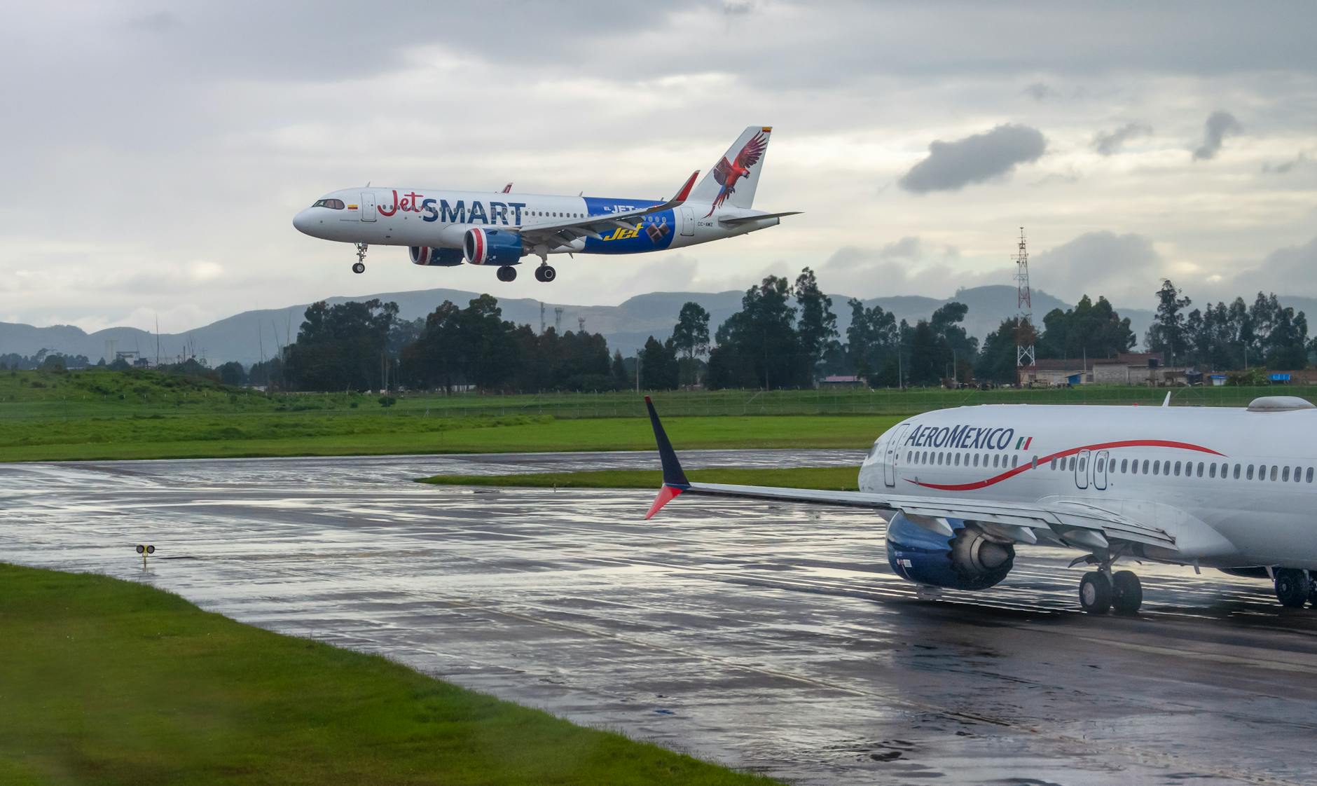 Aeromexico aircraft on an airport runway under a cloudy sky