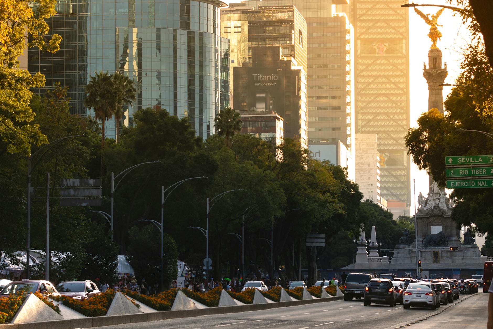Angel of Independence and Mexico City skyscrapers at sunset
