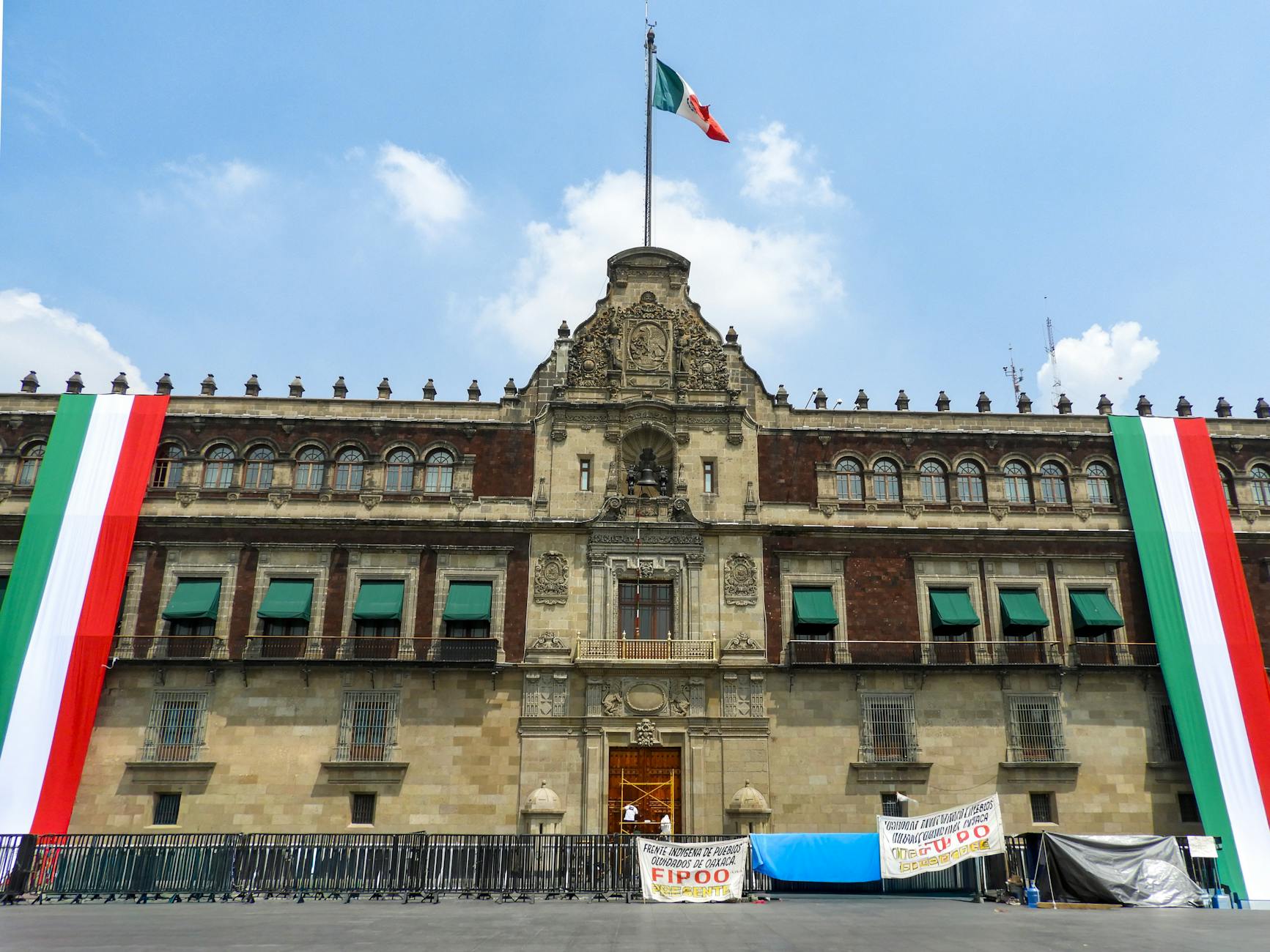 National Palace in Mexico City with large Mexican flags
