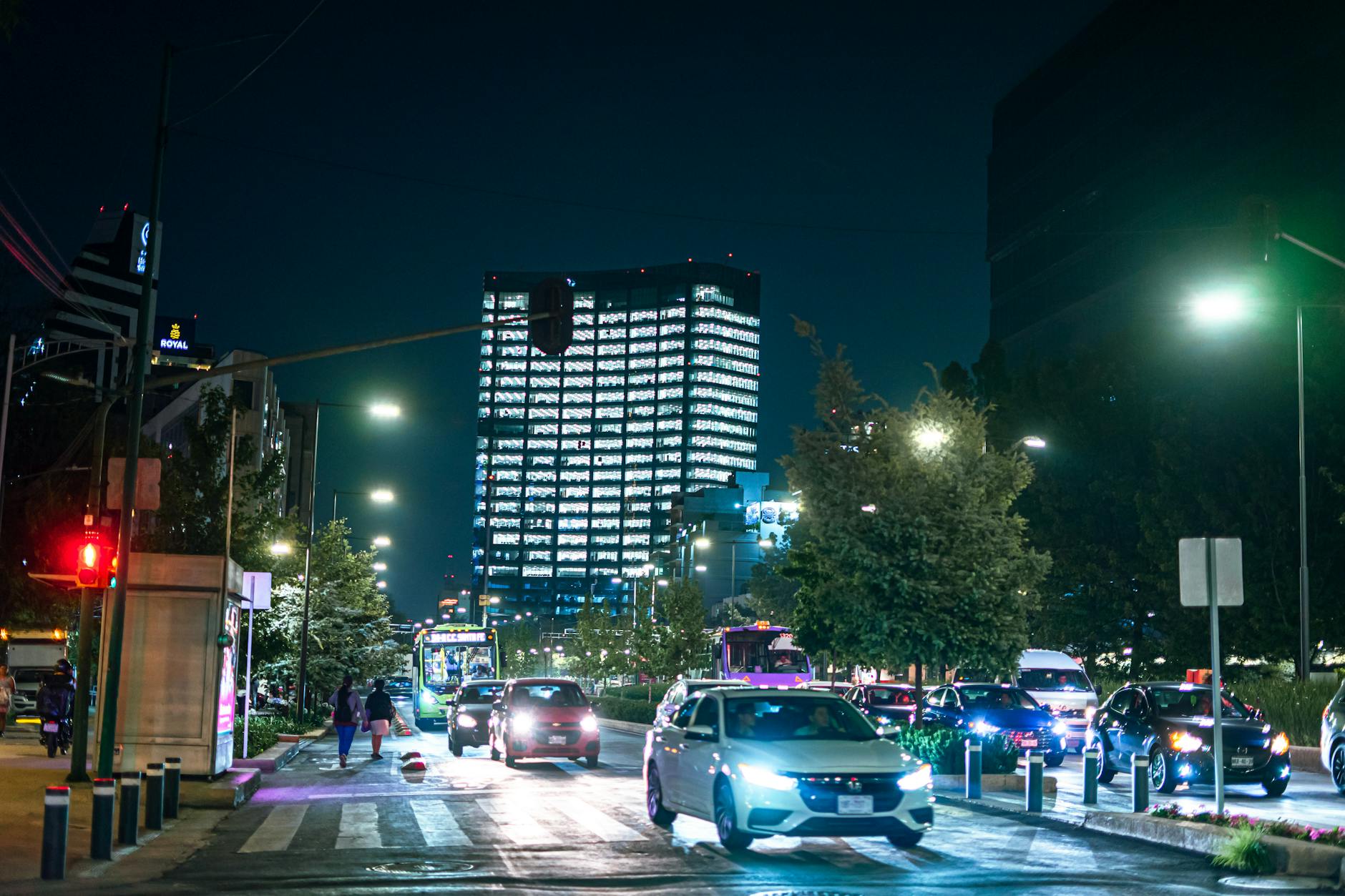 Night traffic and illuminated buildings in Mexico City