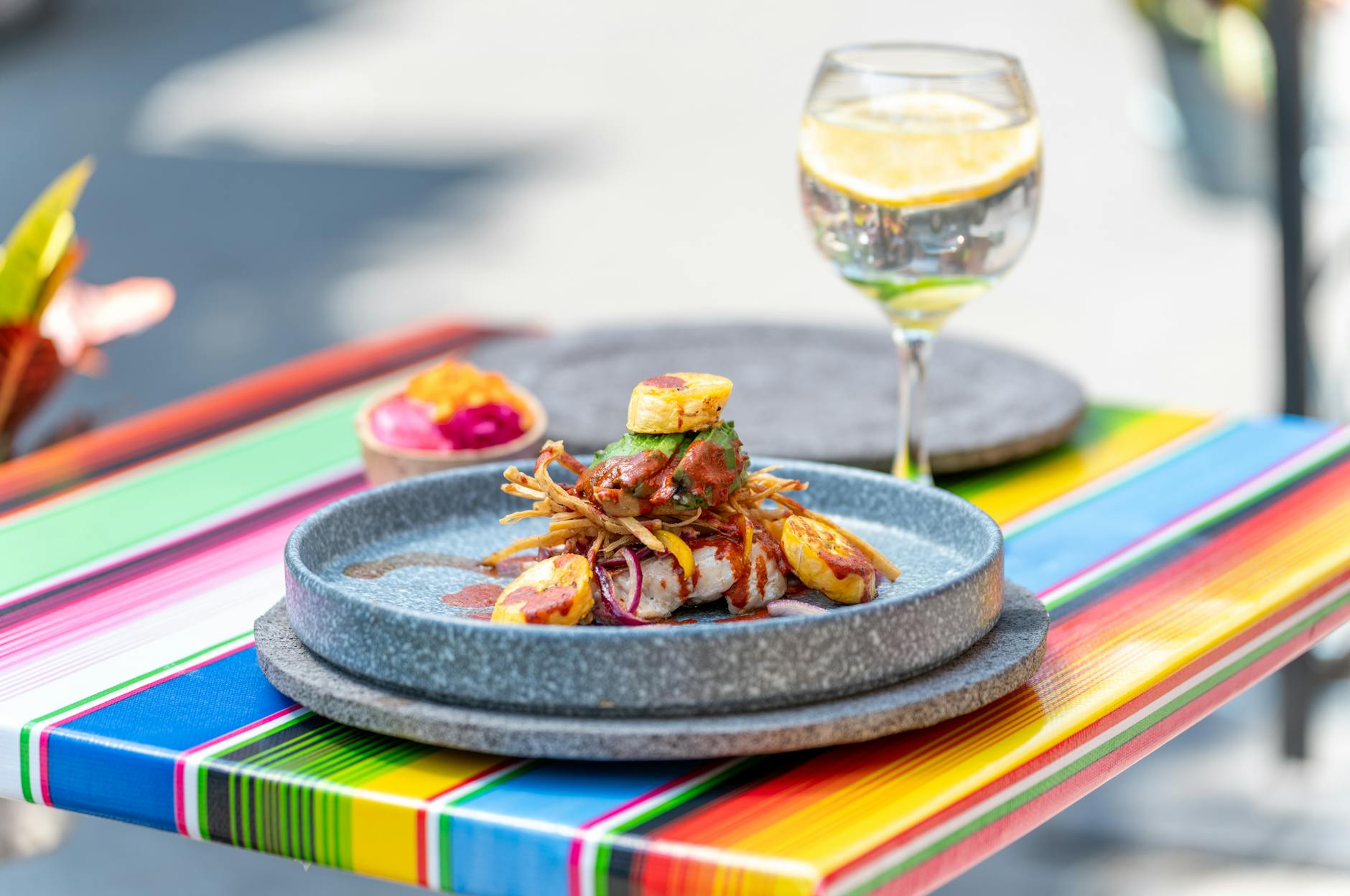 Gourmet Mexican dish and cocktail served outdoors in Mexico City