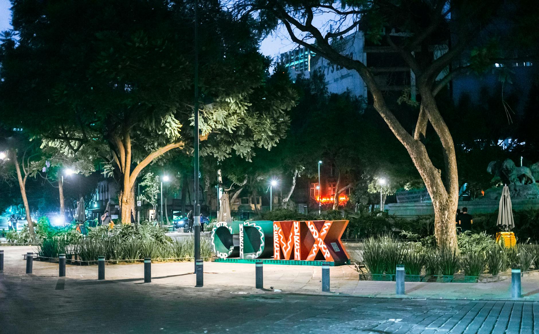 Illuminated CDMX sign in a Mexico City park at night
