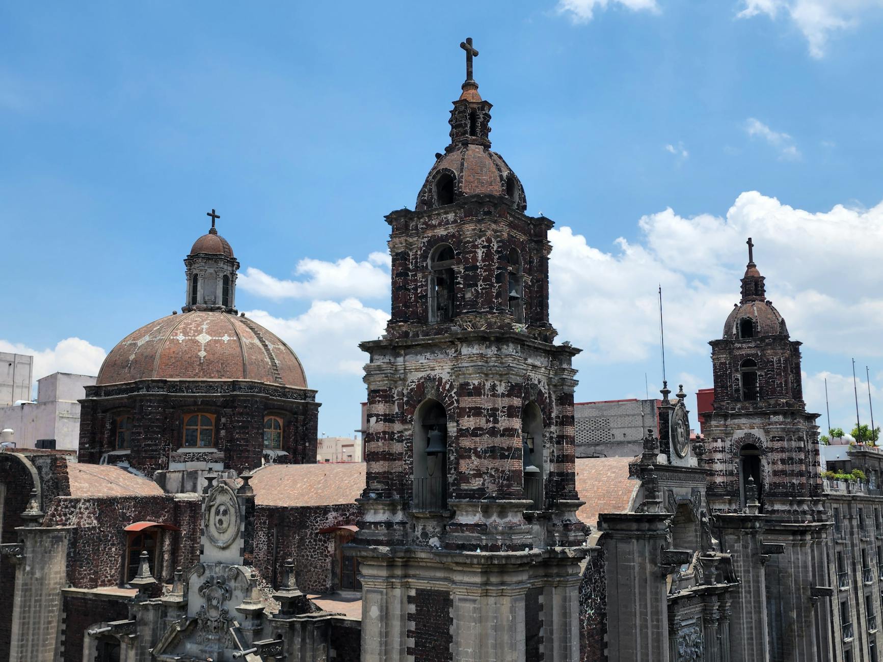 Baroque church architecture in Mexico City under a bright sky