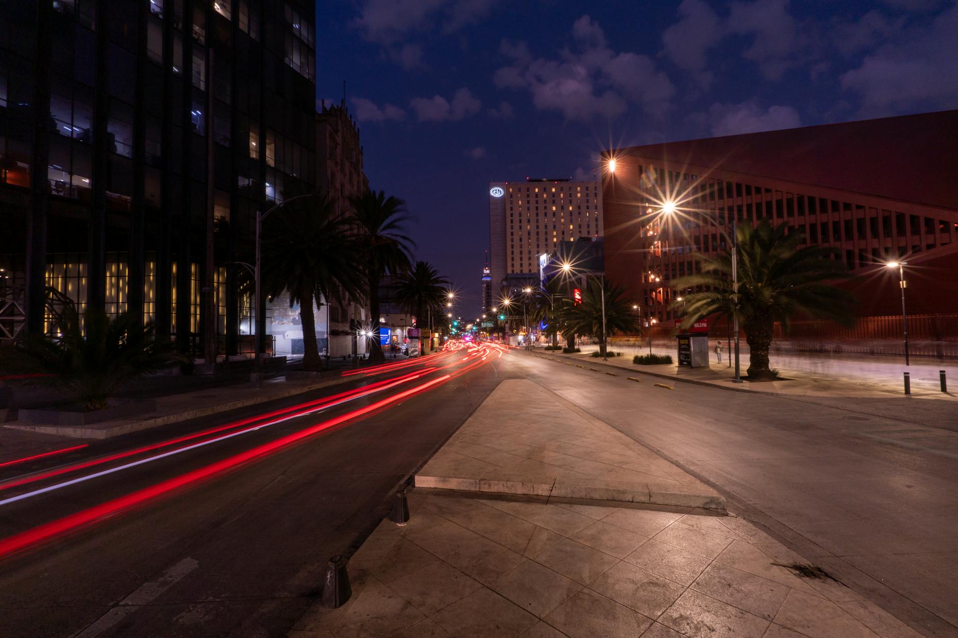 Mexico City street at night with traffic light trails