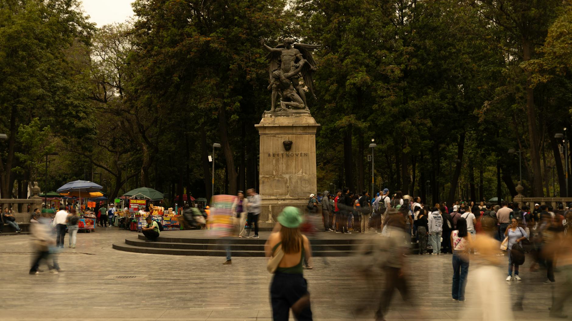 Crowd gathered in a Mexico City park near the Beethoven statue