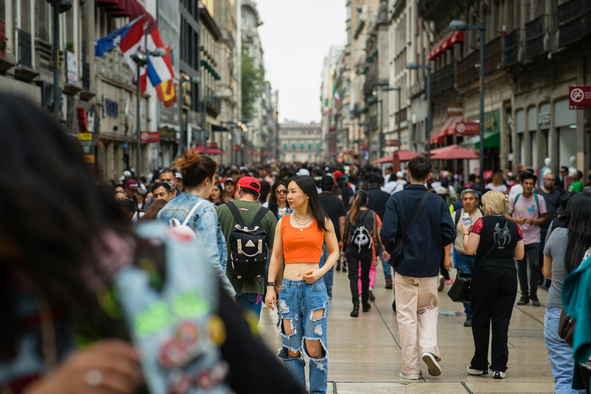 Woman walking through a crowded Mexico City street