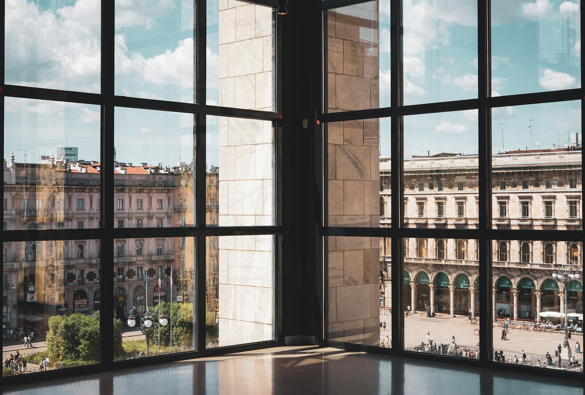 Piazza del Duomo in Milan seen through large windows