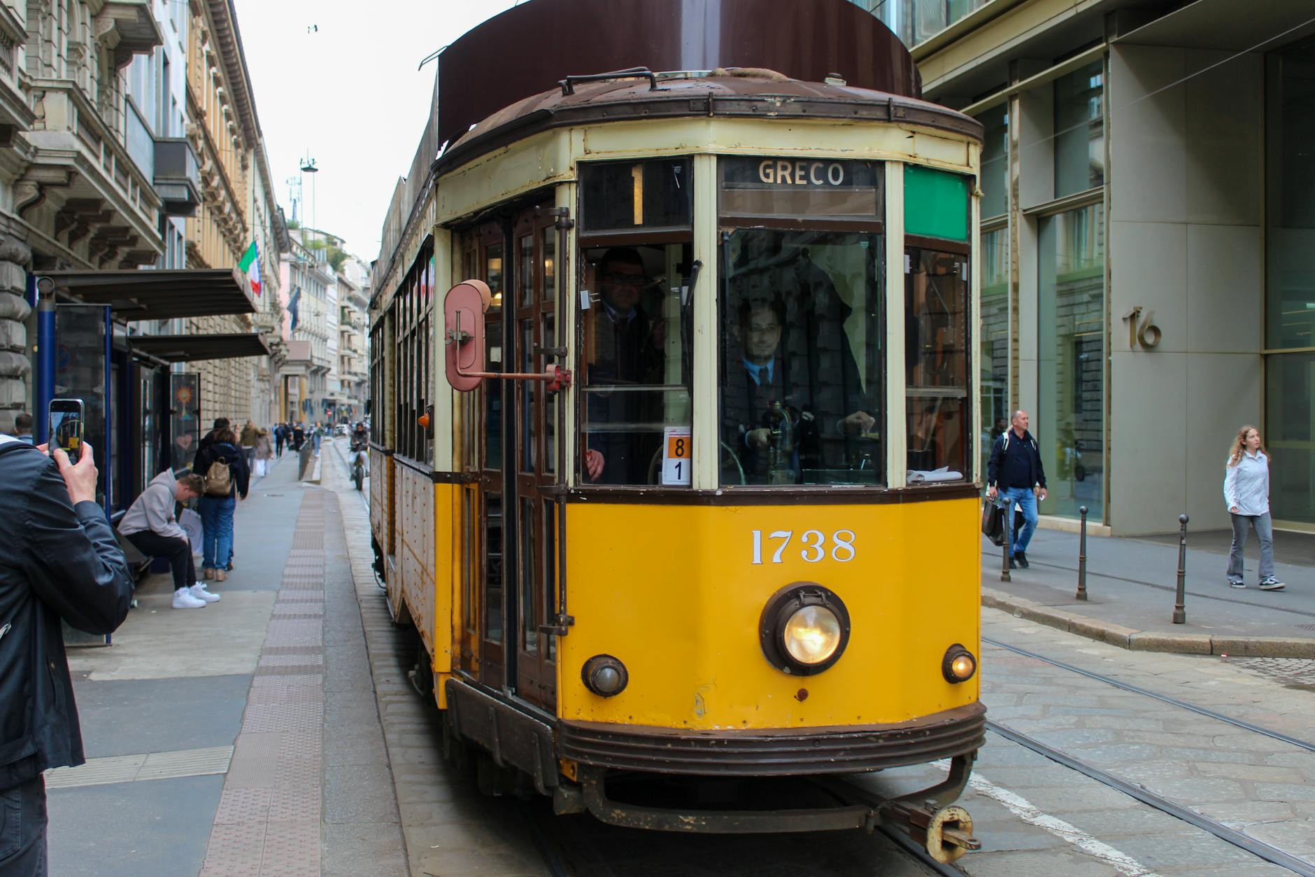 Vintage tram on a busy Milan street