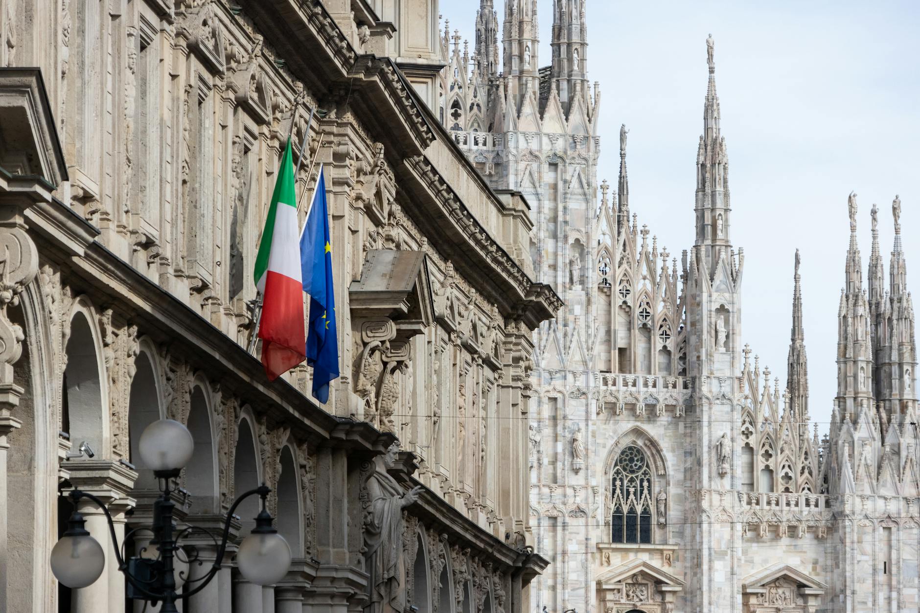 Duomo di Milano with Italian and European Union flags