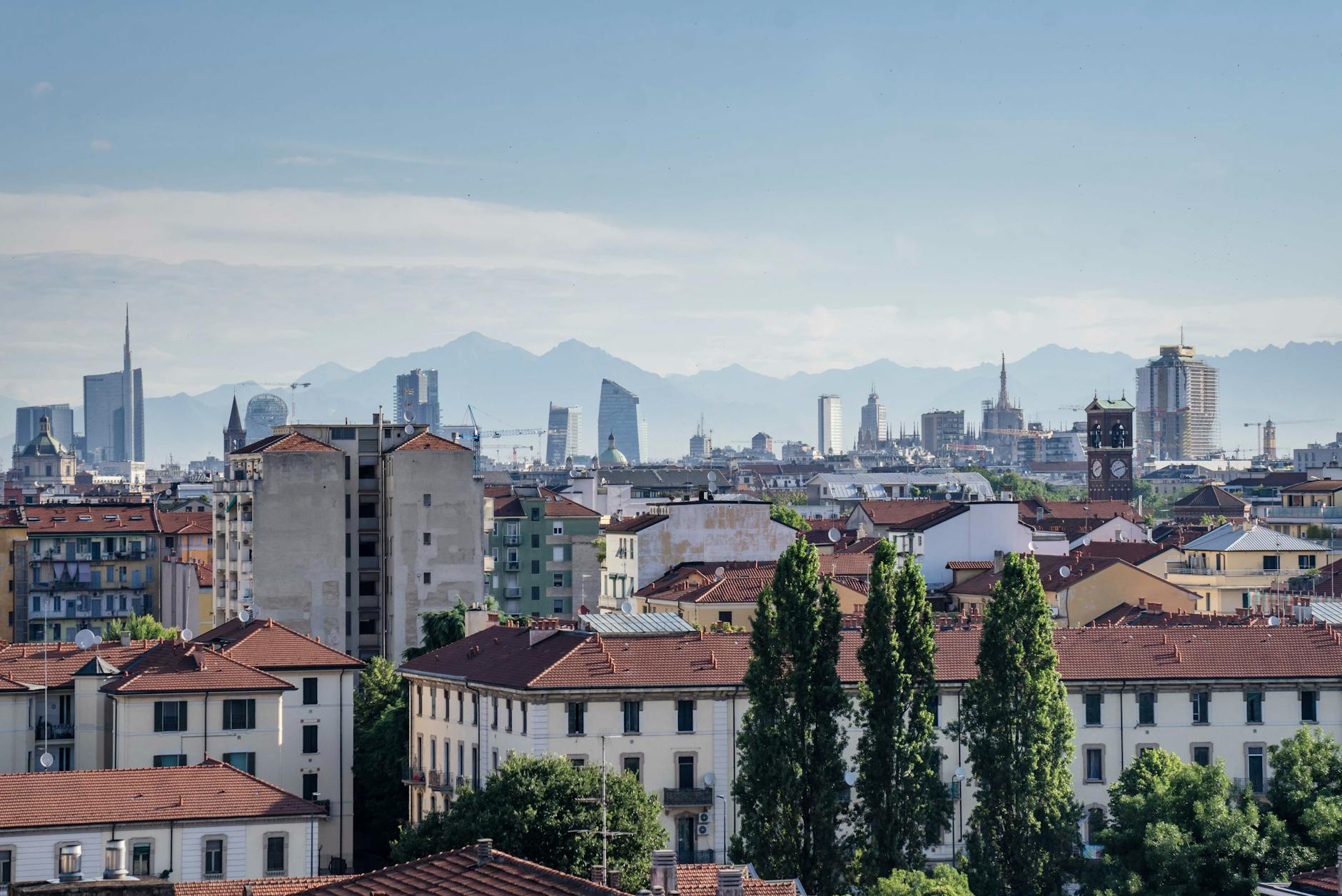 Aerial view of Milan skyline and mountains