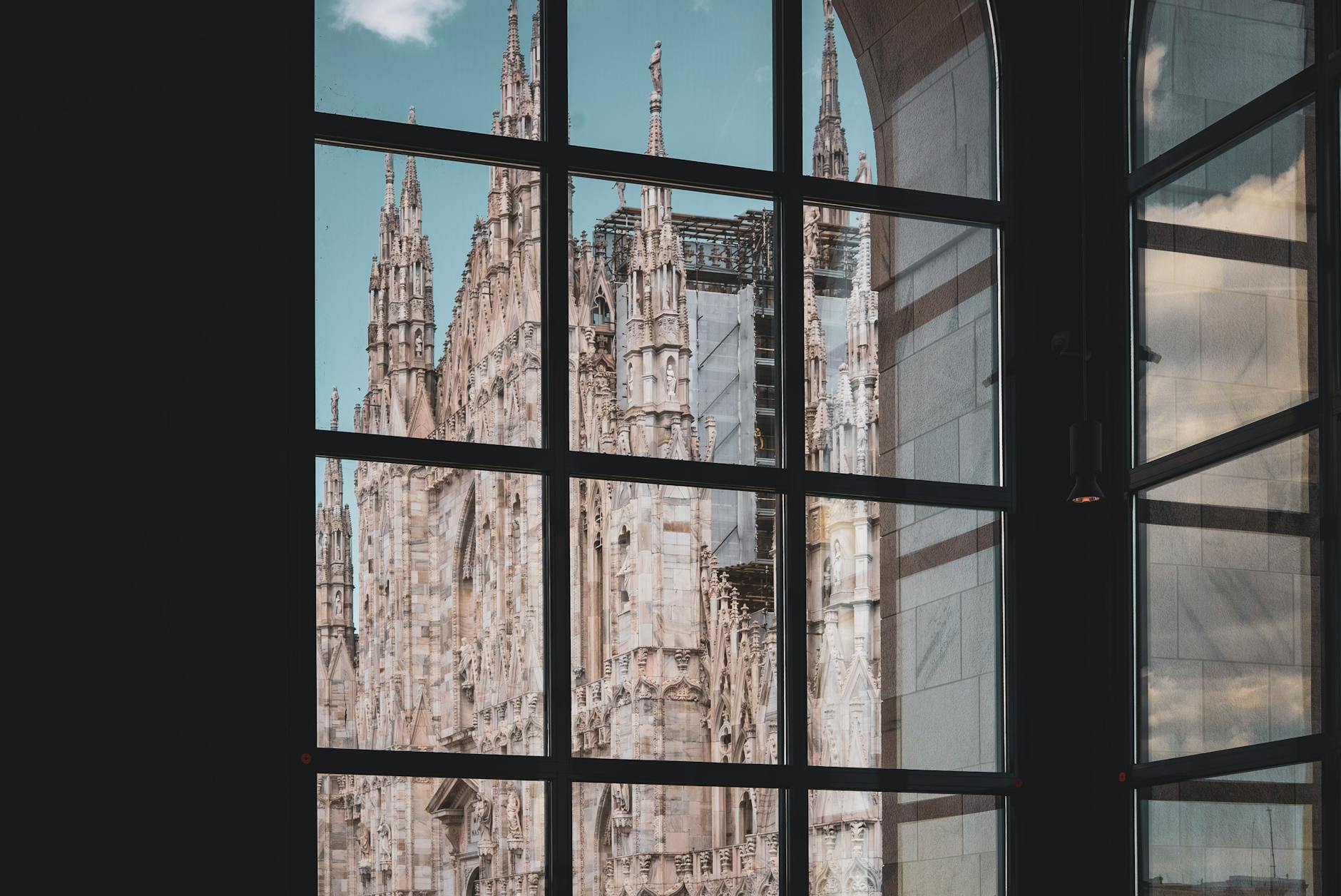 Reflection of Milan Cathedral in a window