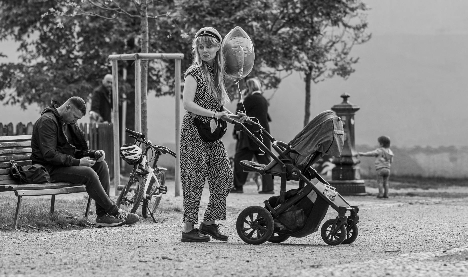 Family stroller scene in a Milan park