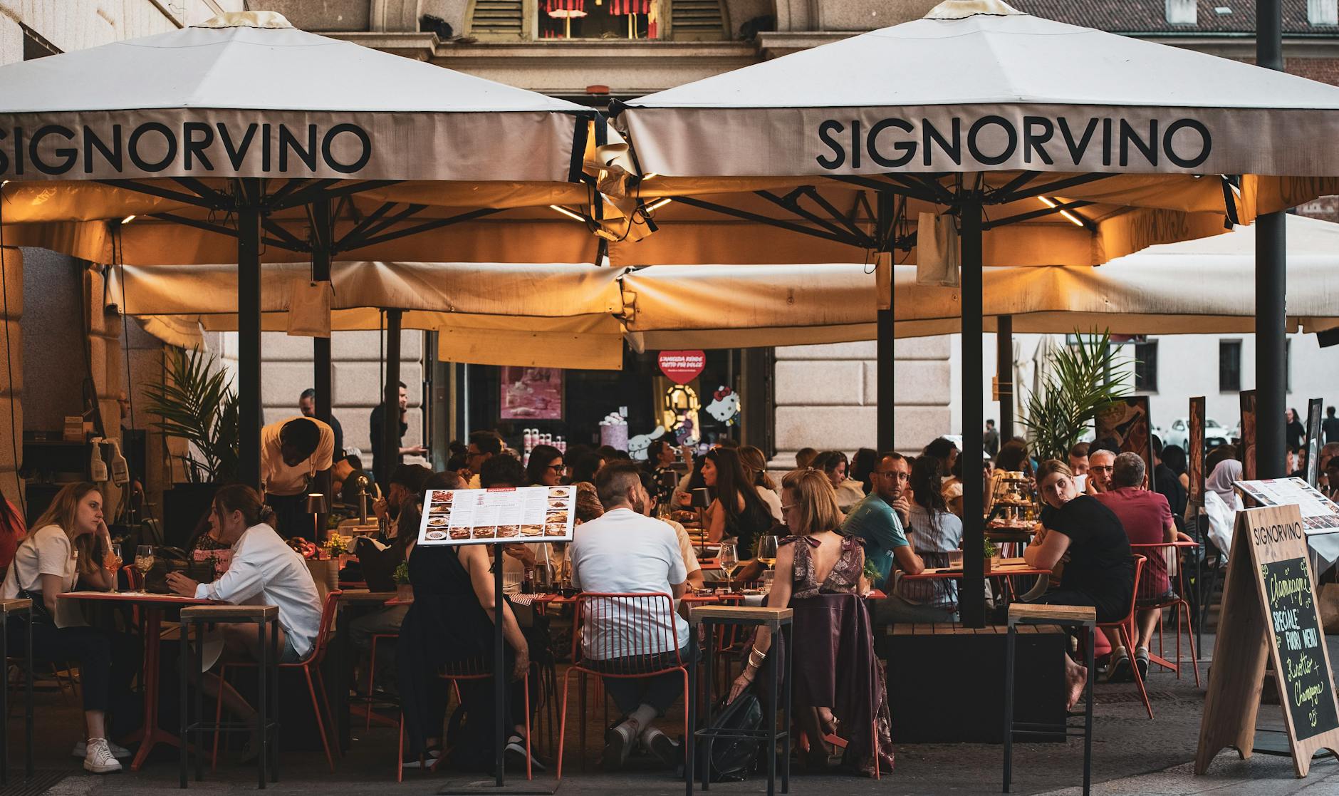 Diners at an evening restaurant in central Milan