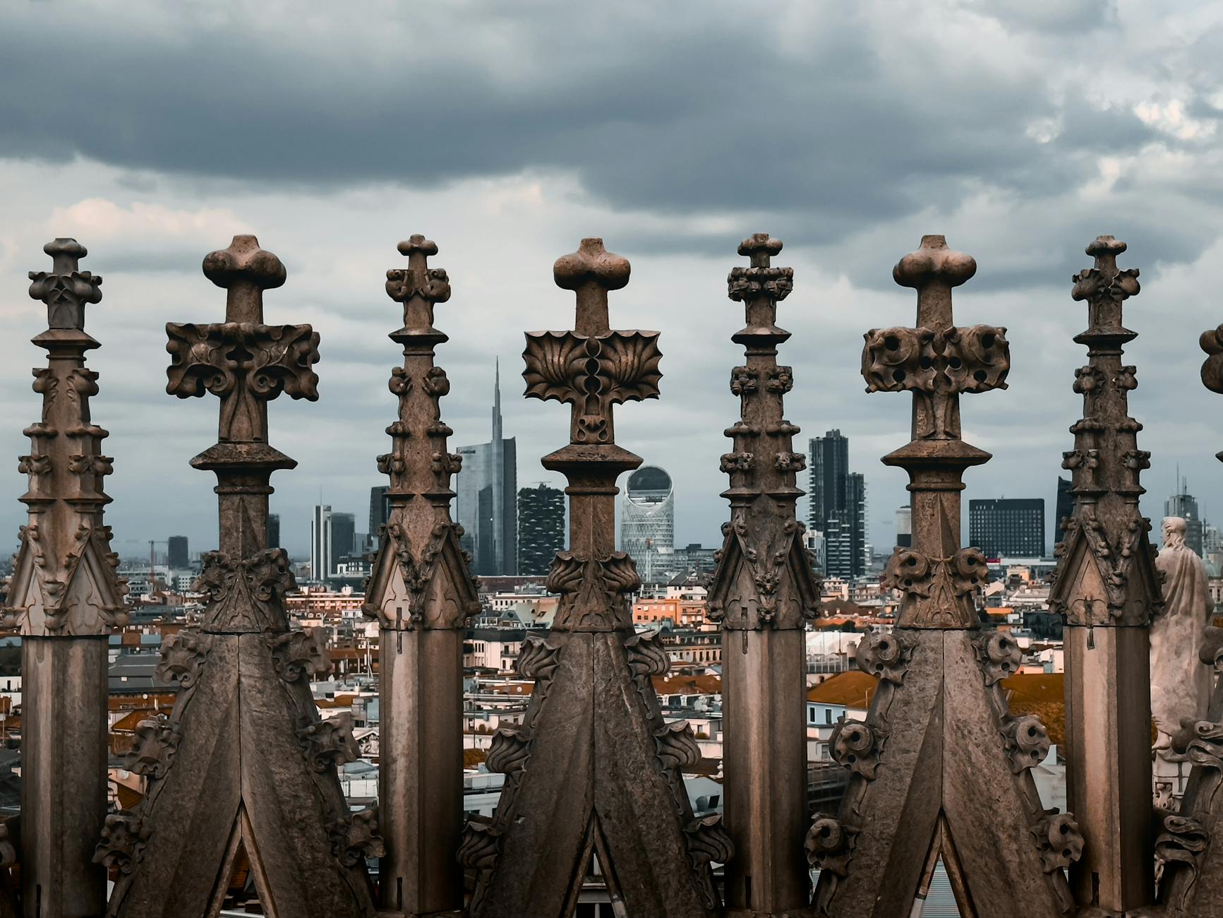 Milan Cathedral rooftop with skyline in the background
