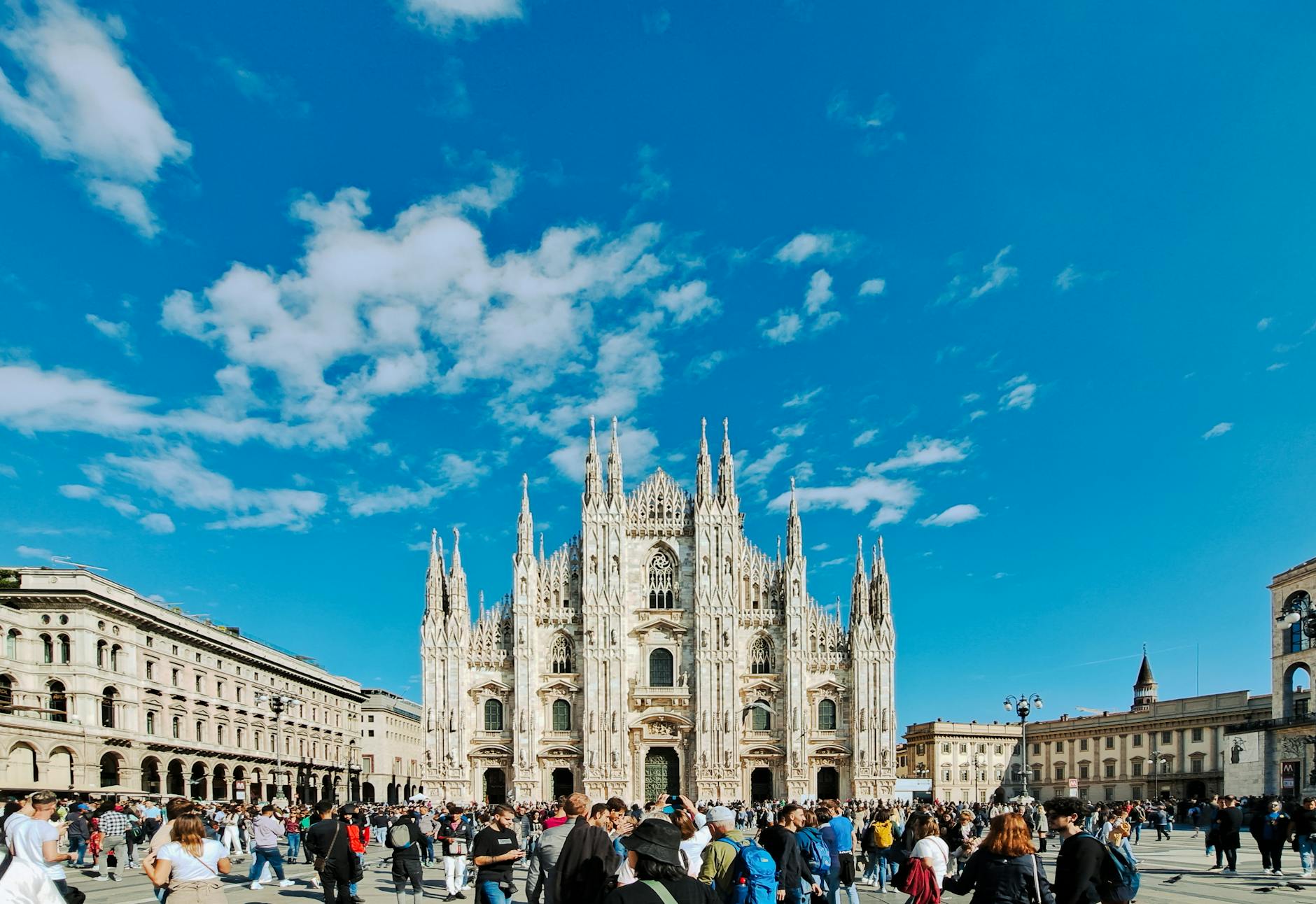 Crowds near Milan Cathedral on a sunny day