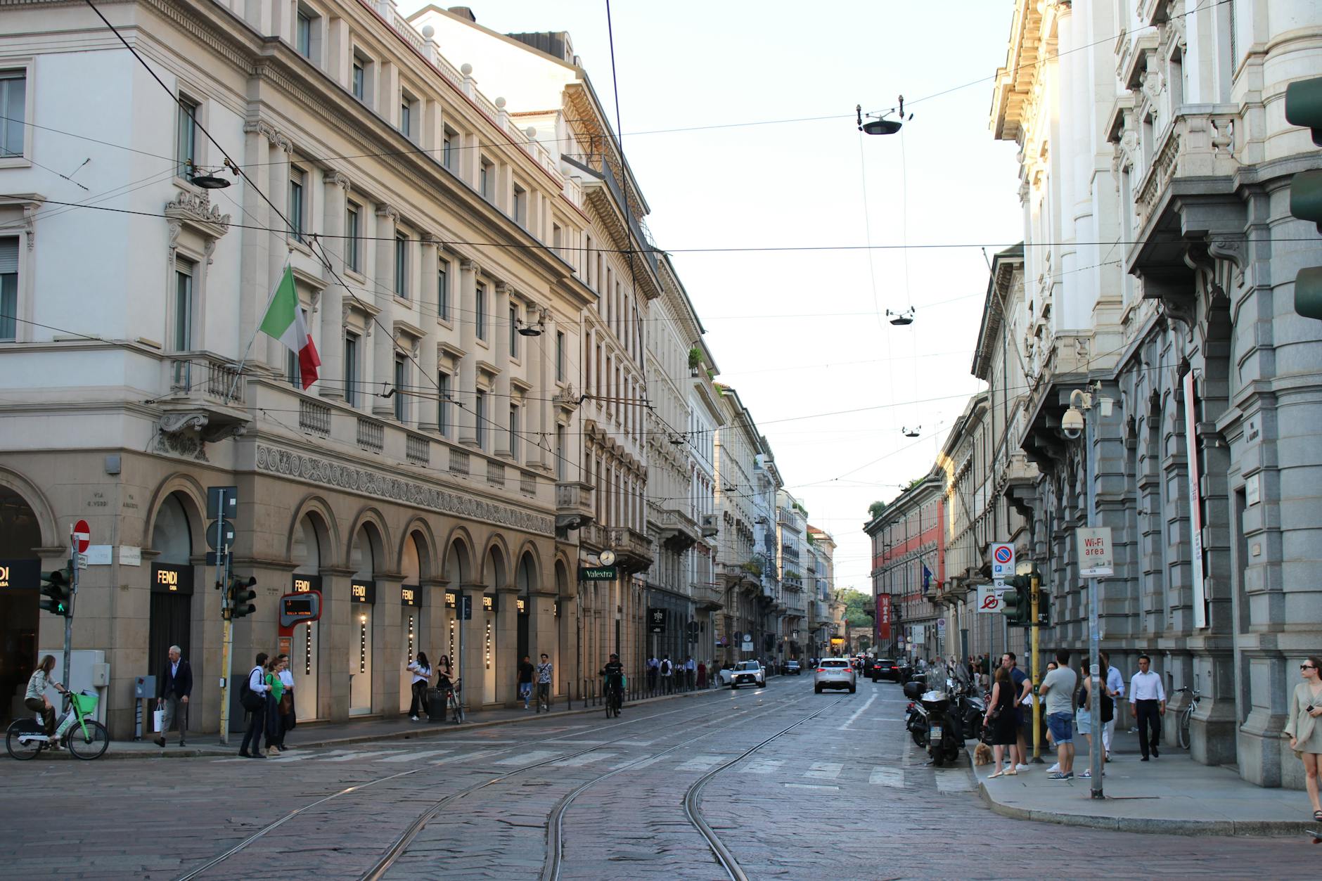 Busy Milan street with historic architecture