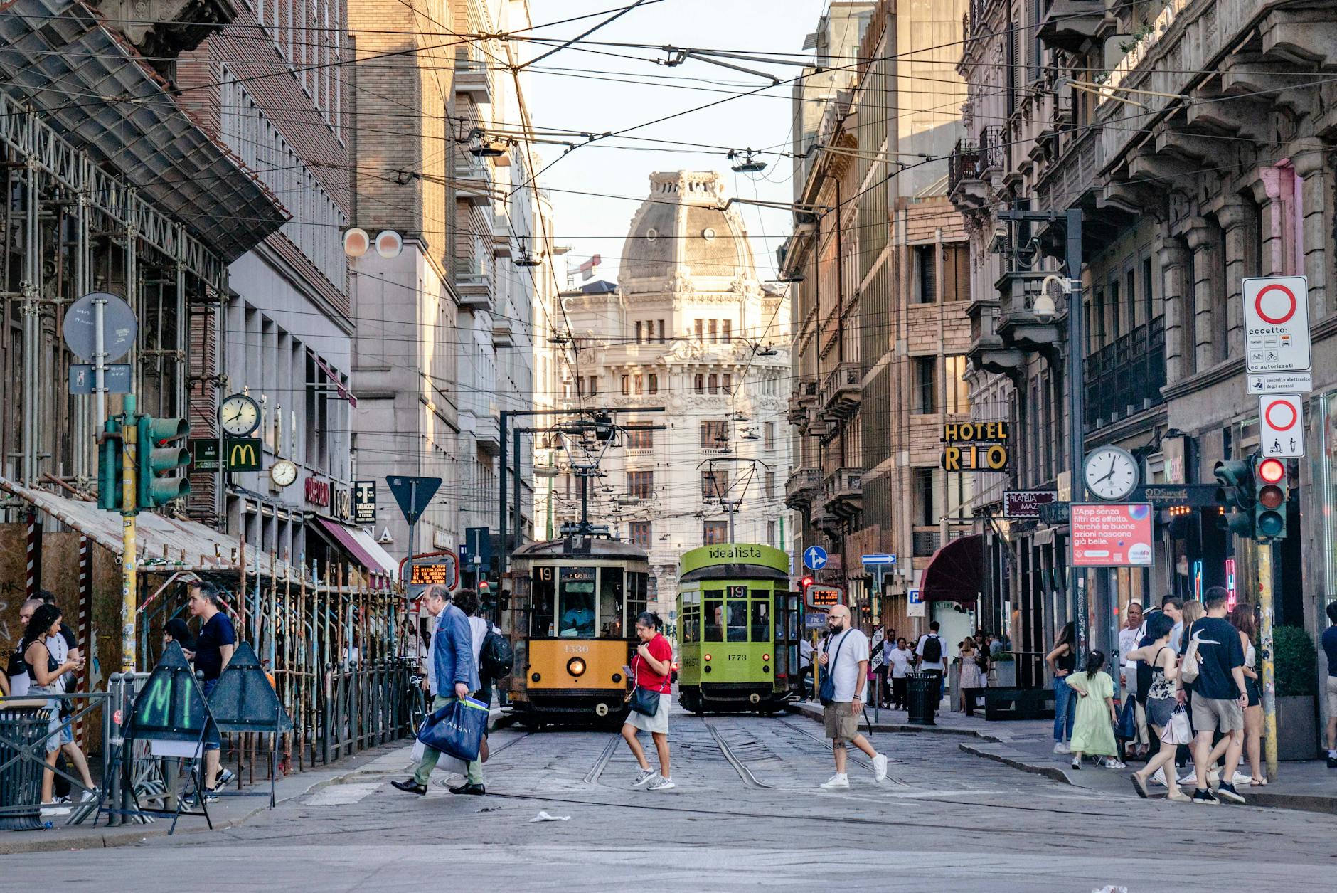 Milan street with trams and pedestrians