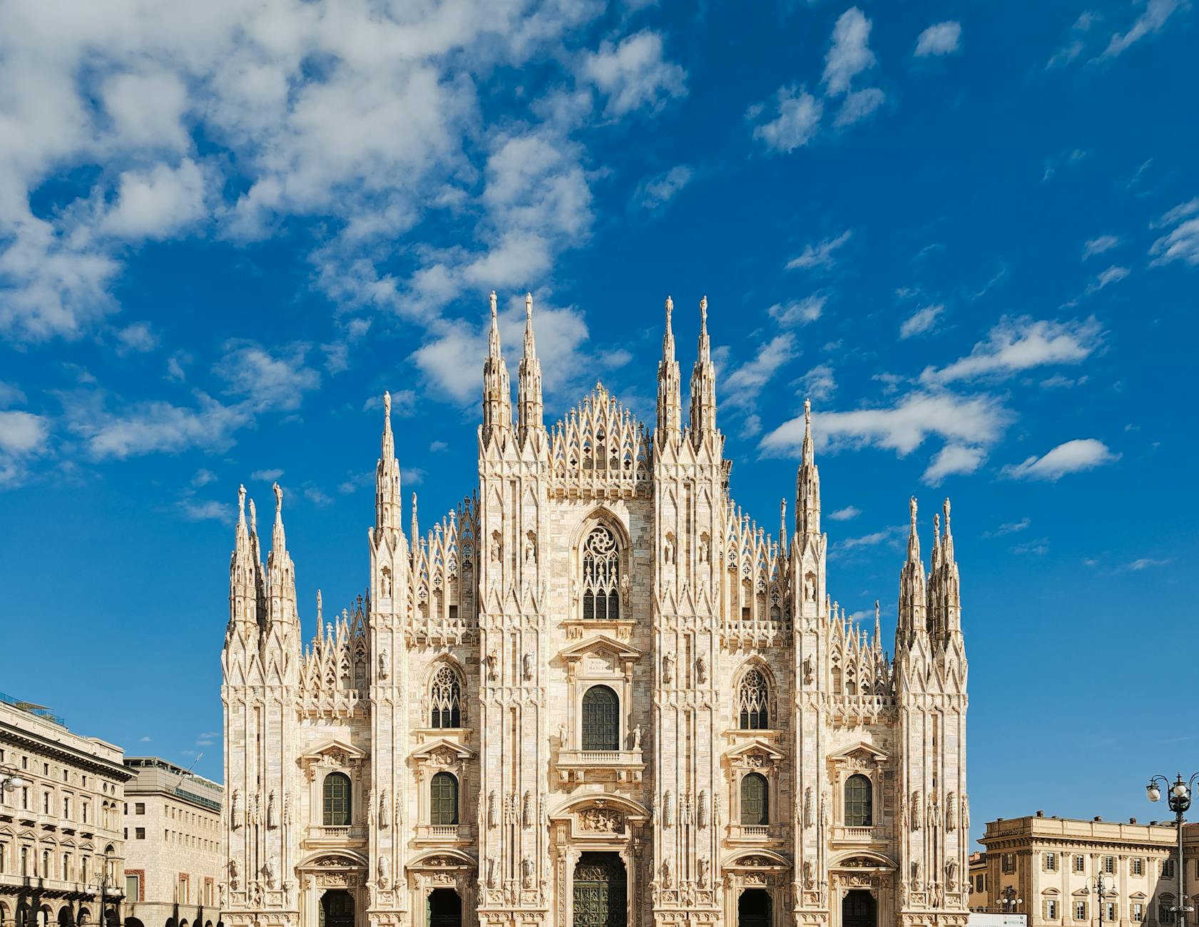 Duomo di Milano against a bright blue sky