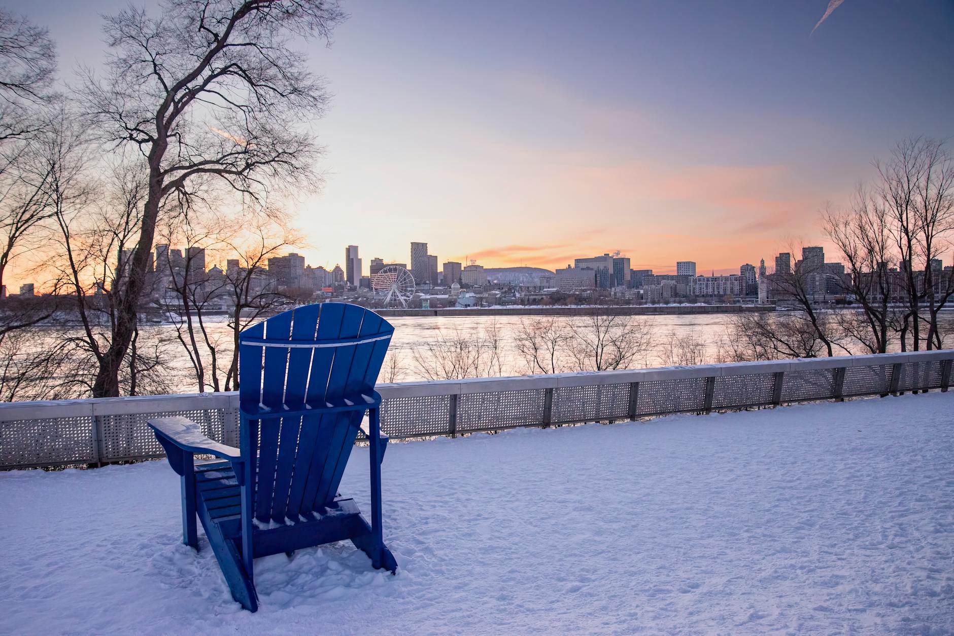 Snowy winter cityscape at sunset