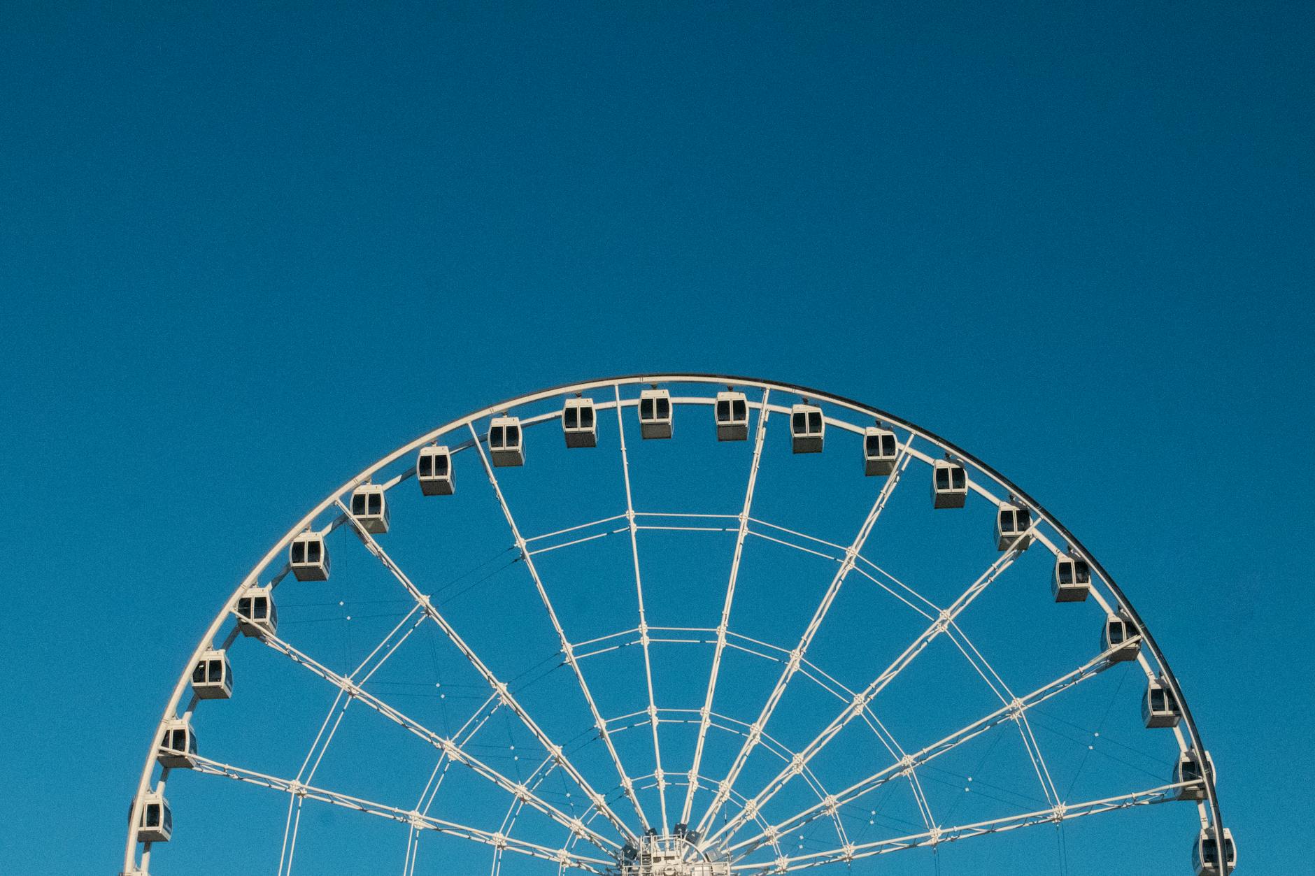 Ferris wheel in Montreal against a blue sky