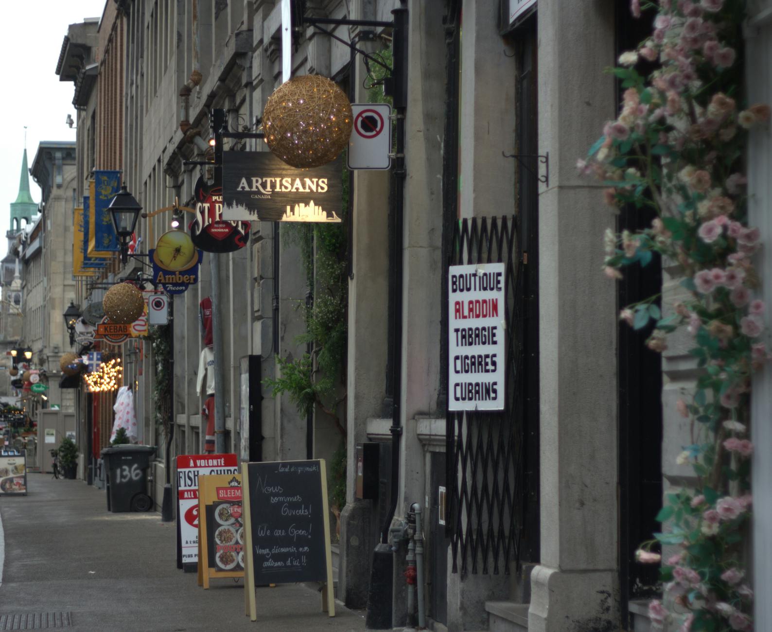 Old Montreal street with shops and signs