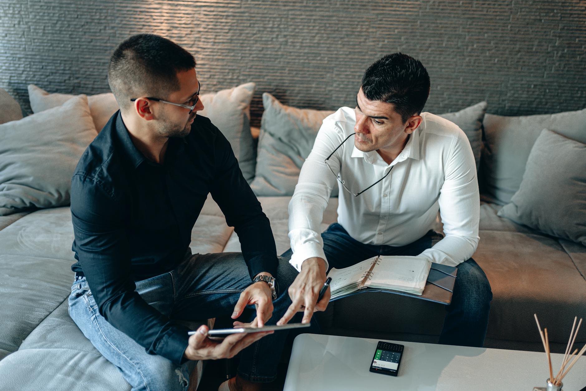 Business colleagues collaborating on a tablet
