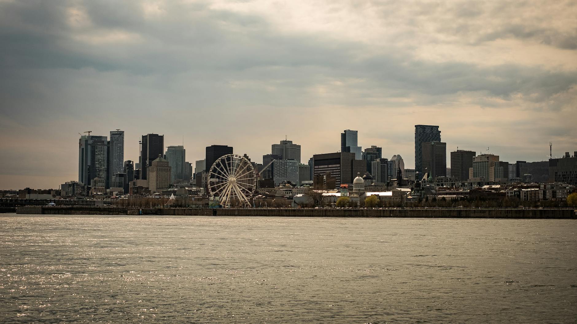 Montreal skyline and Ferris wheel by the water