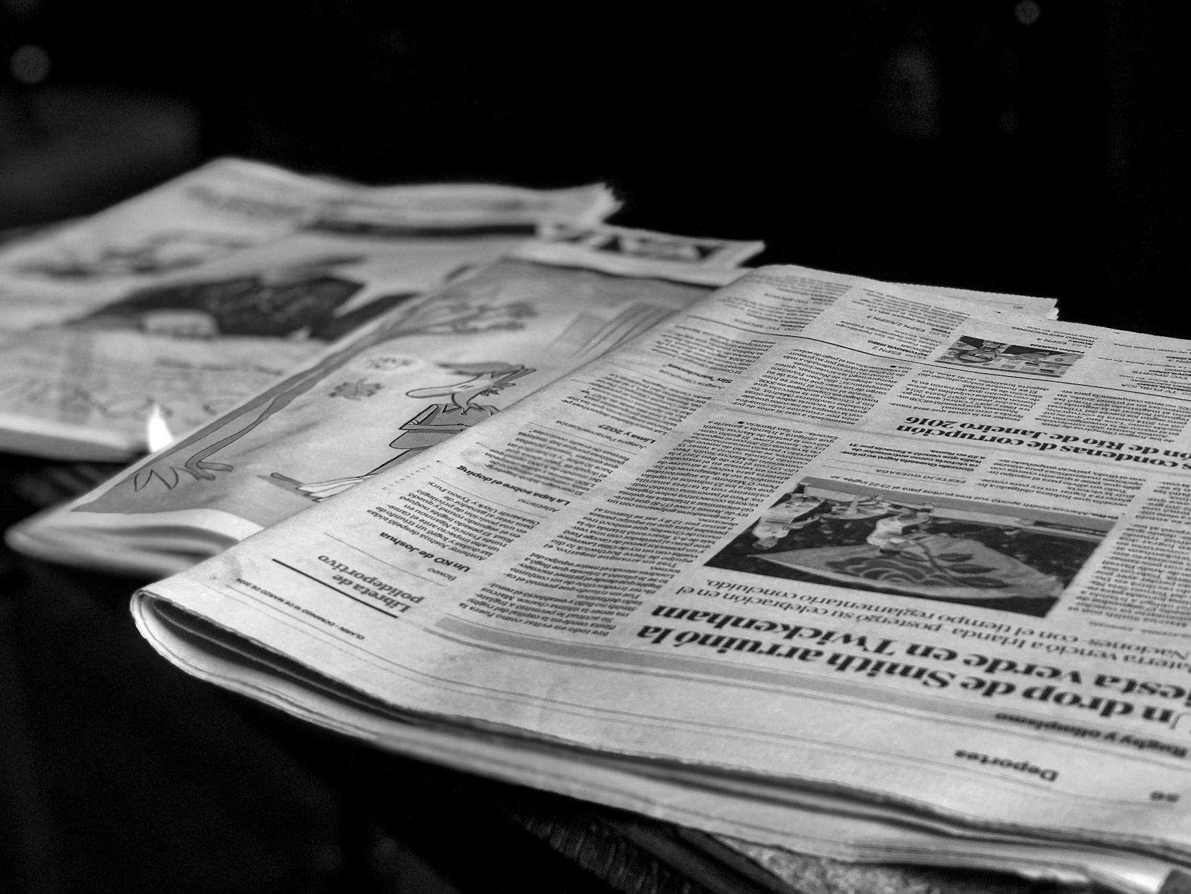 Newspapers on a table