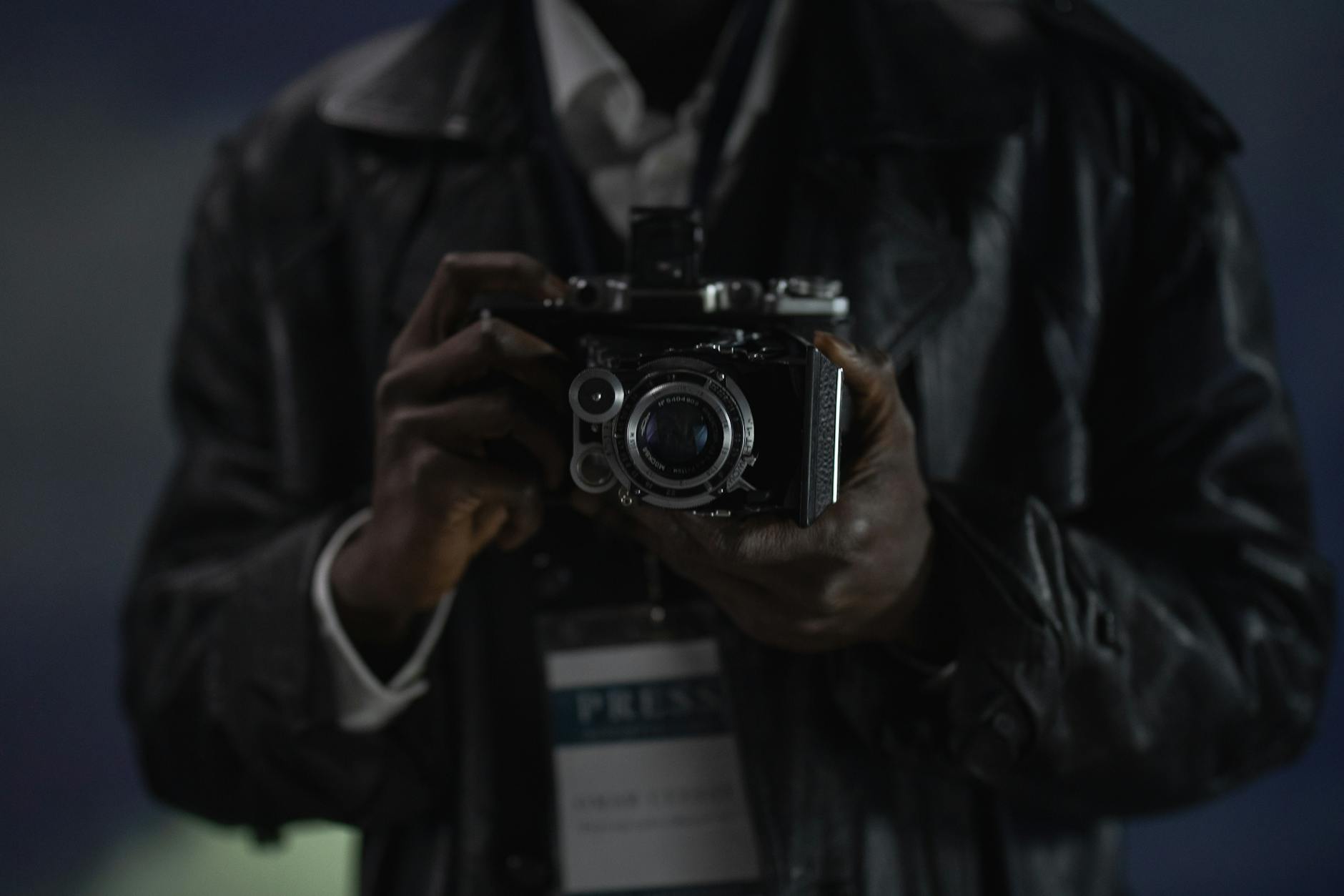 Person holding a vintage camera