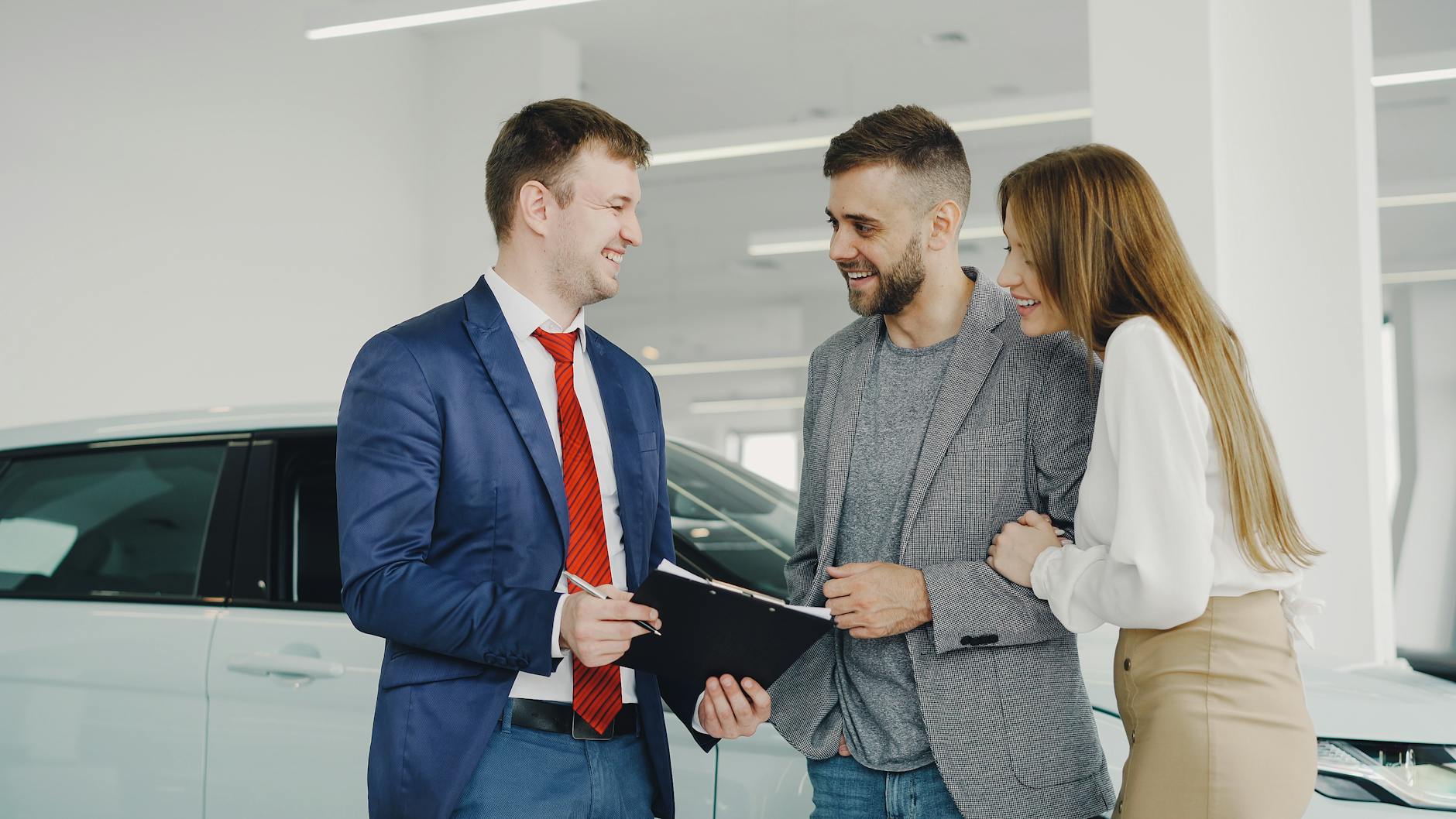 Salesperson speaking with buyers in a showroom