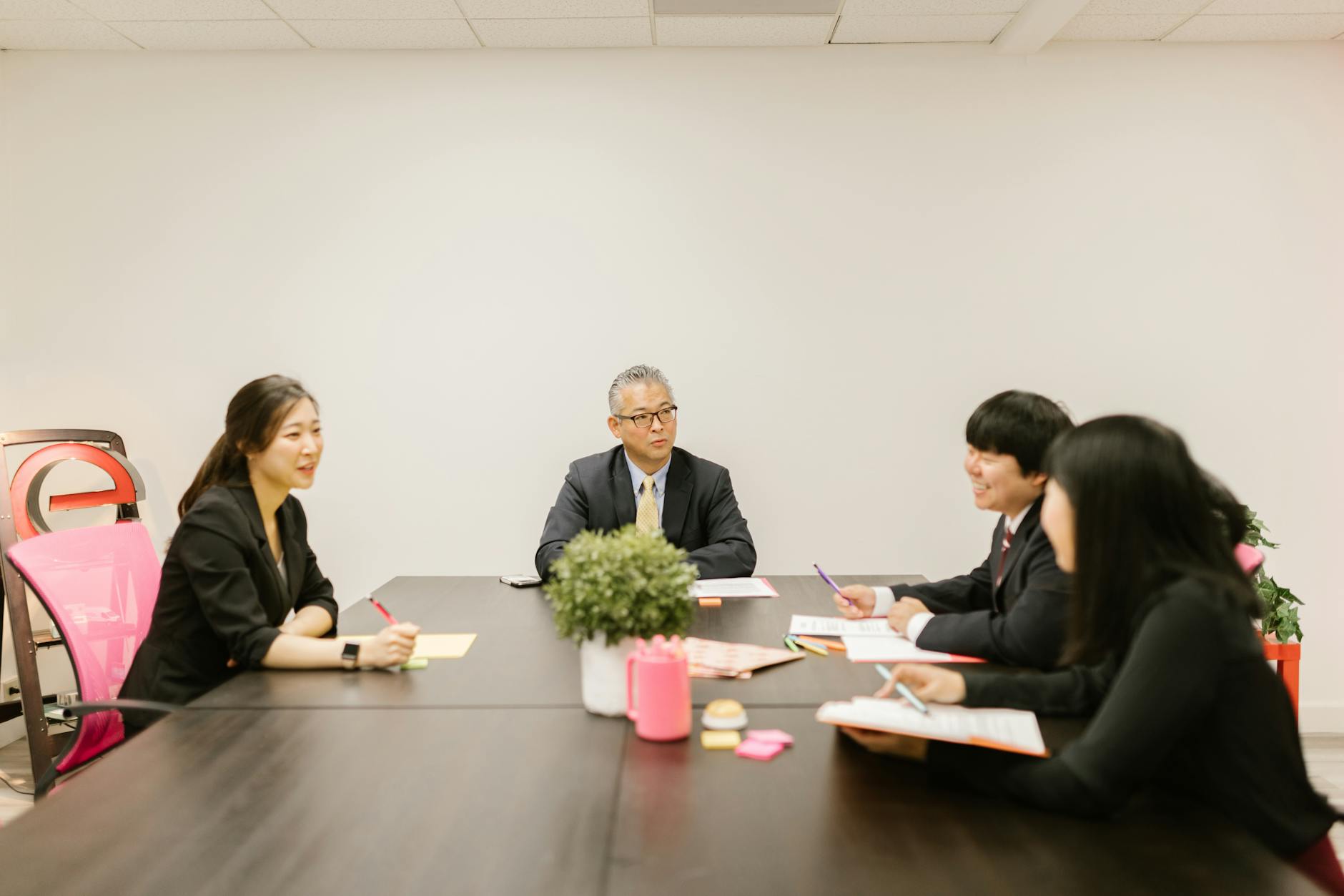 Business meeting around a conference table