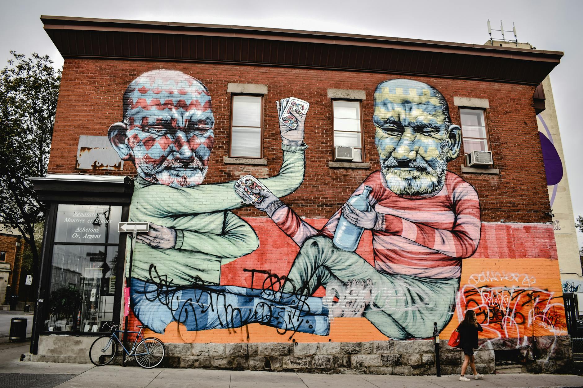 Colorful mural on a Montreal brick wall