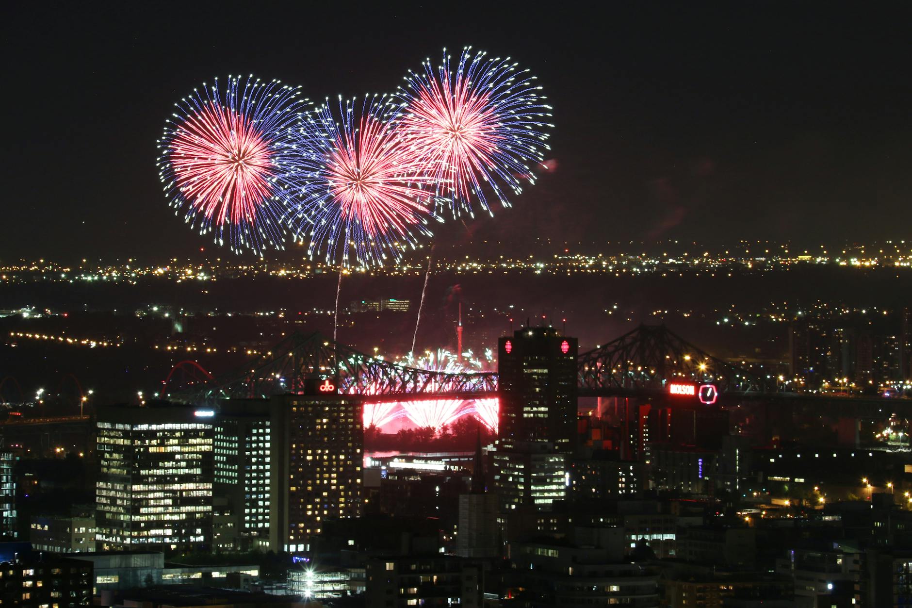 Fireworks over Montreal skyline and Jacques Cartier Bridge