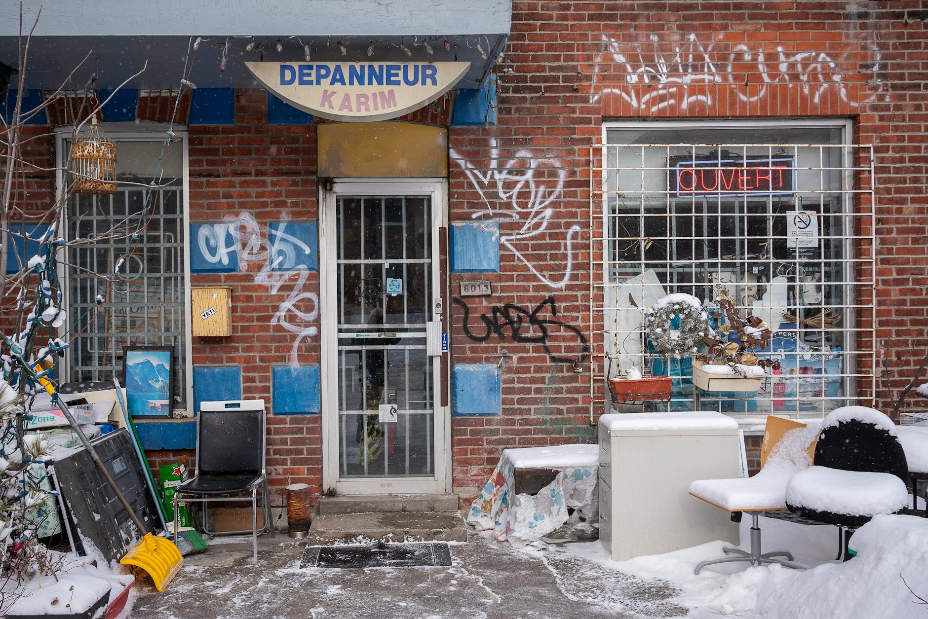 Snow-covered Montreal street outside a depanneur