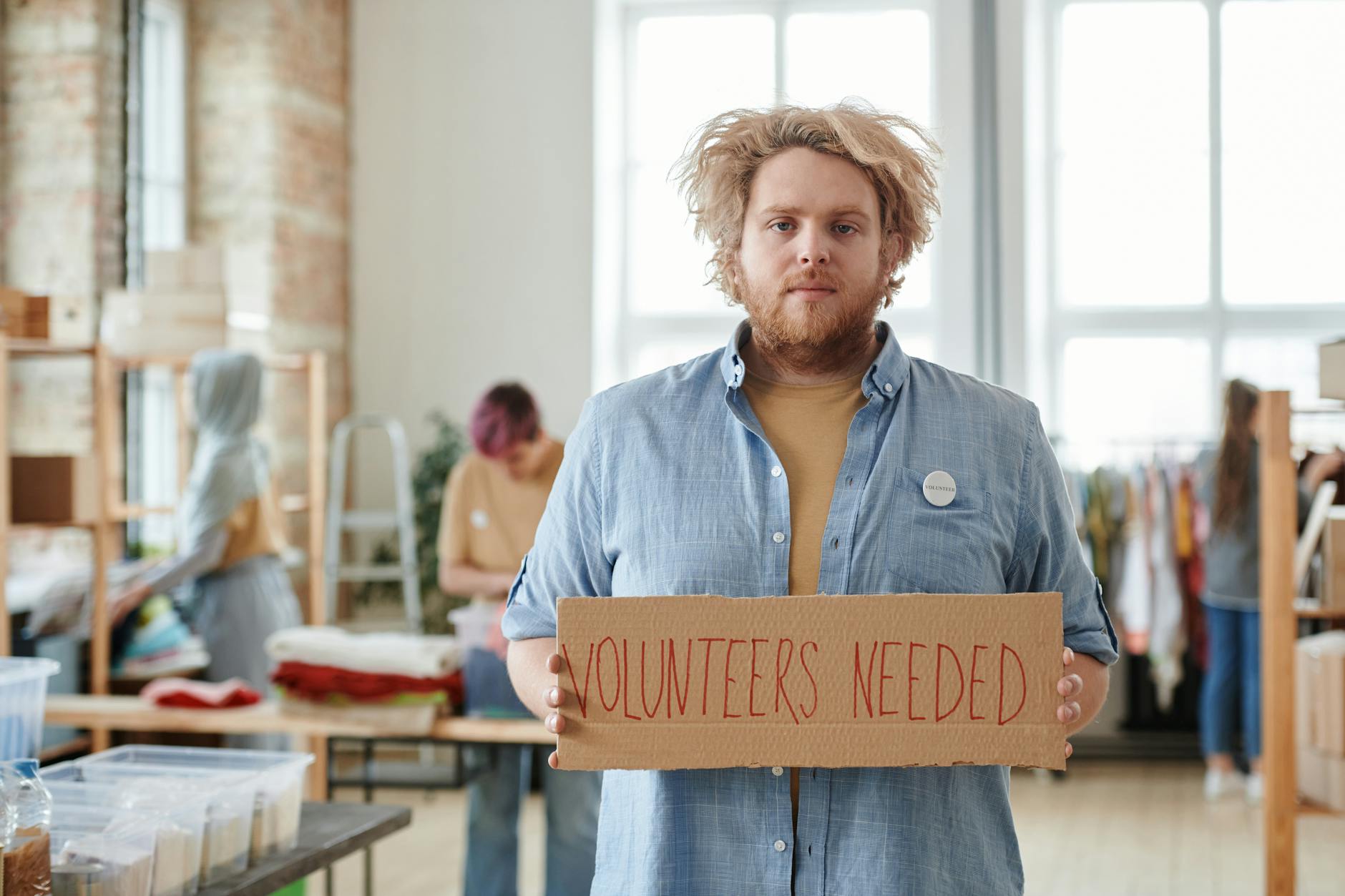Volunteer recruitment sign in a community center
