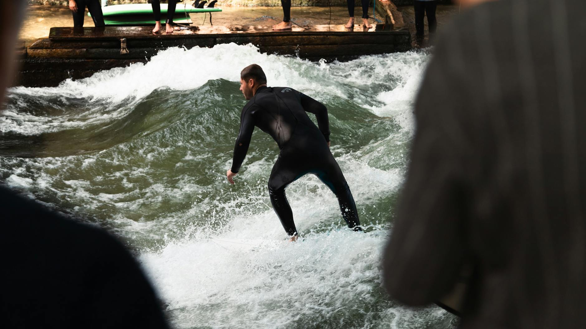 Surfer on the Eisbach River wave in Munich
