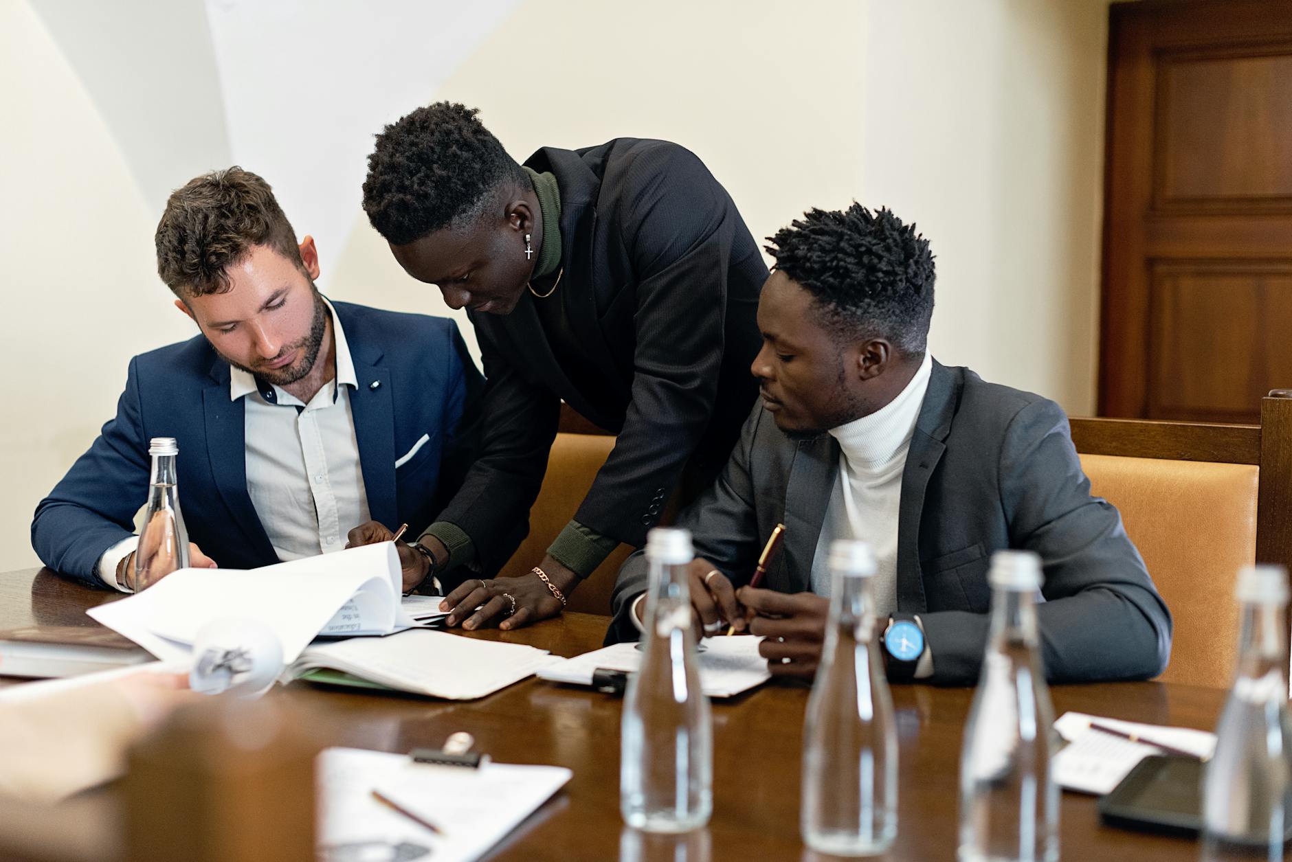 Professionals discussing documents at a table