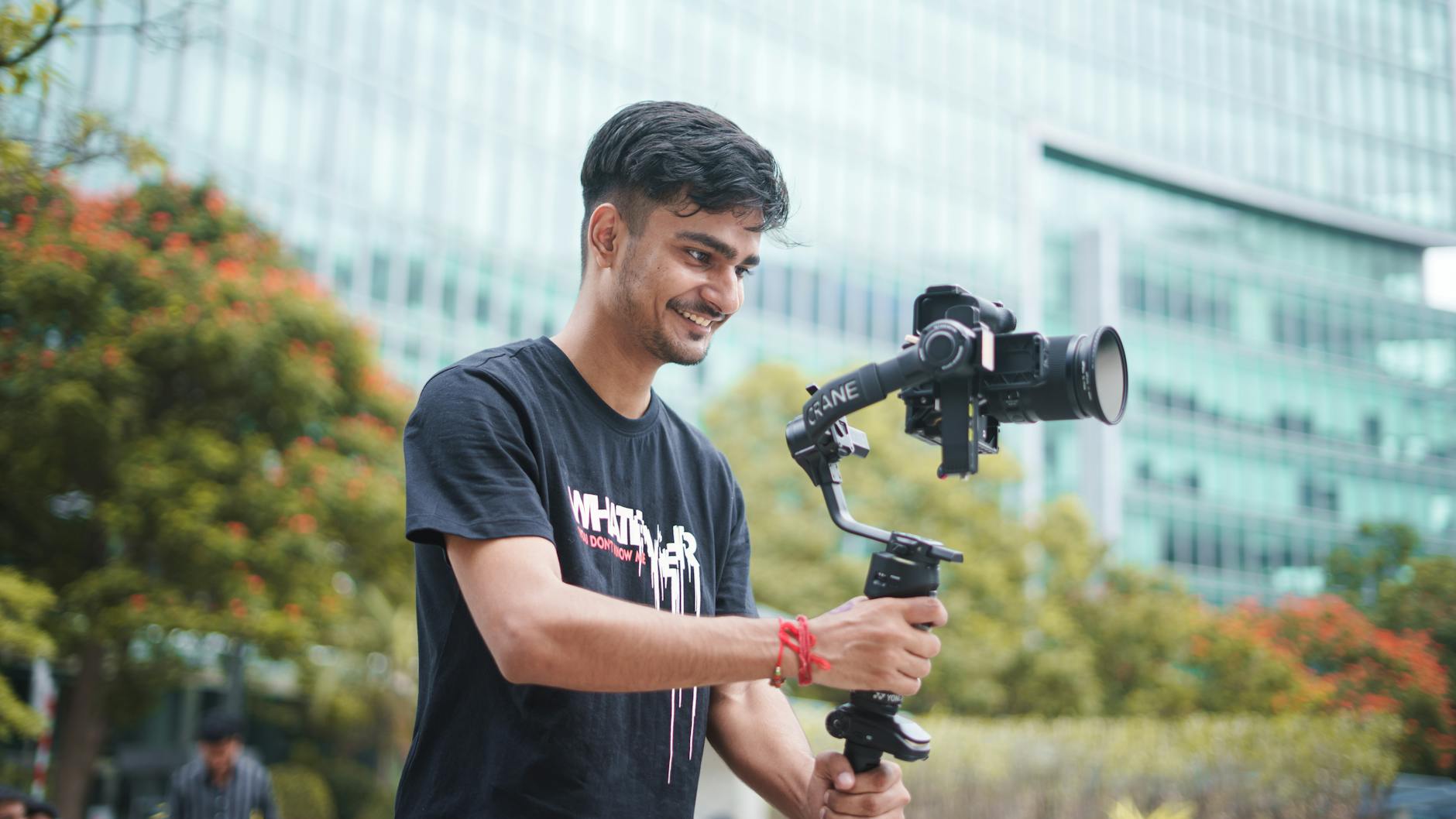 Videographer using a gimbal outdoors