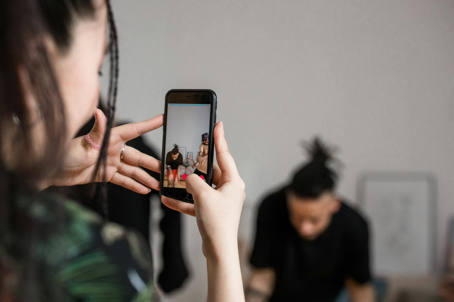 Person recording video with a smartphone