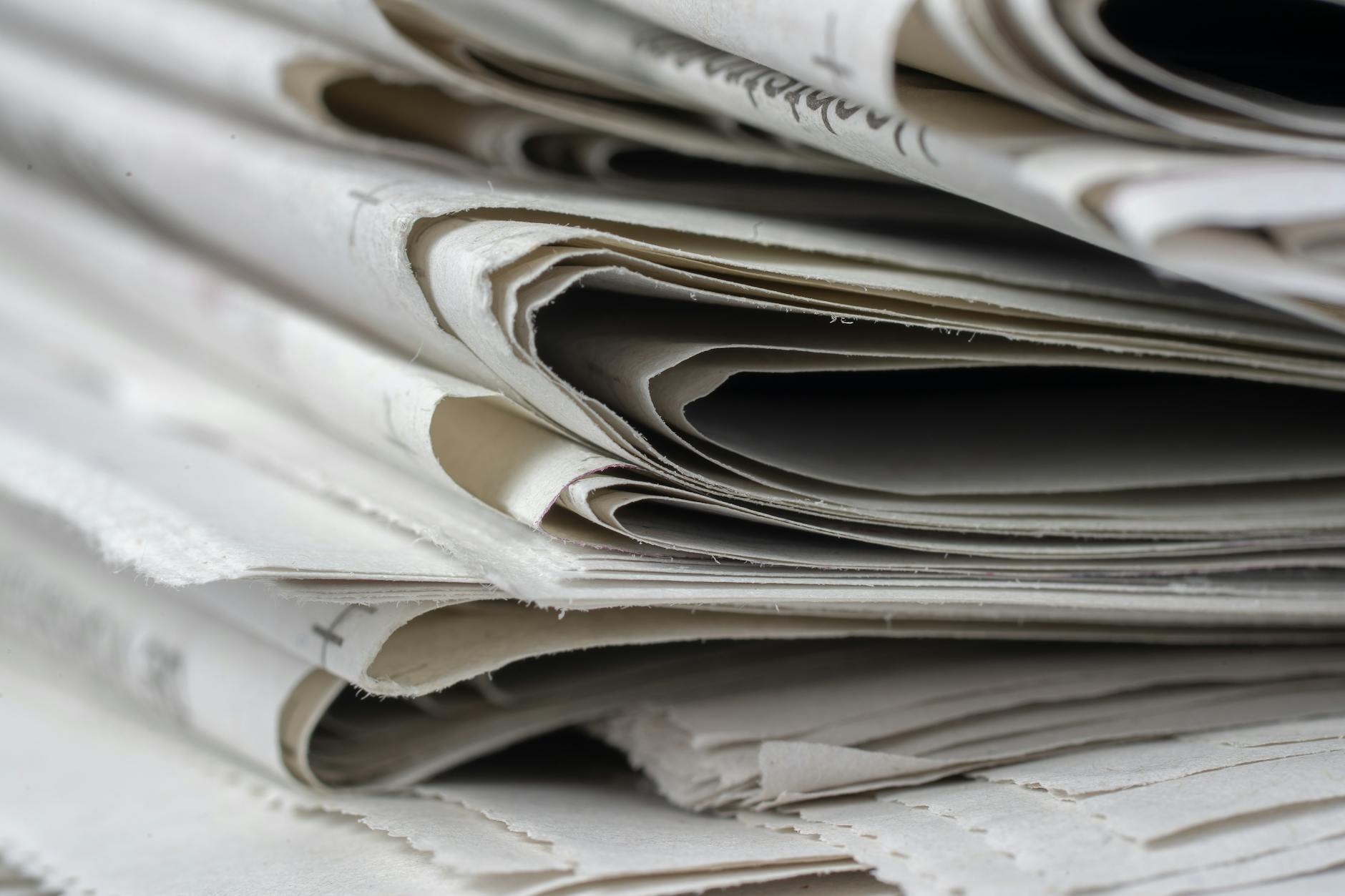 Stacked newspapers