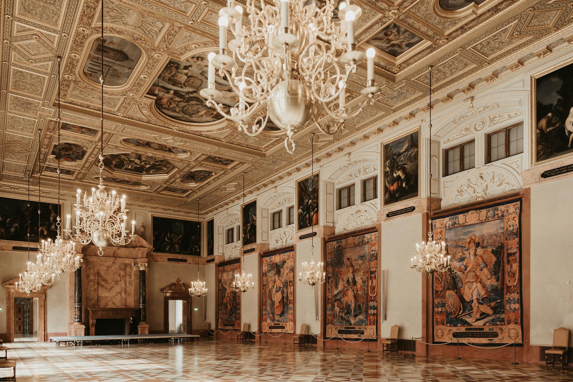Ornate Munich palace hall with chandeliers