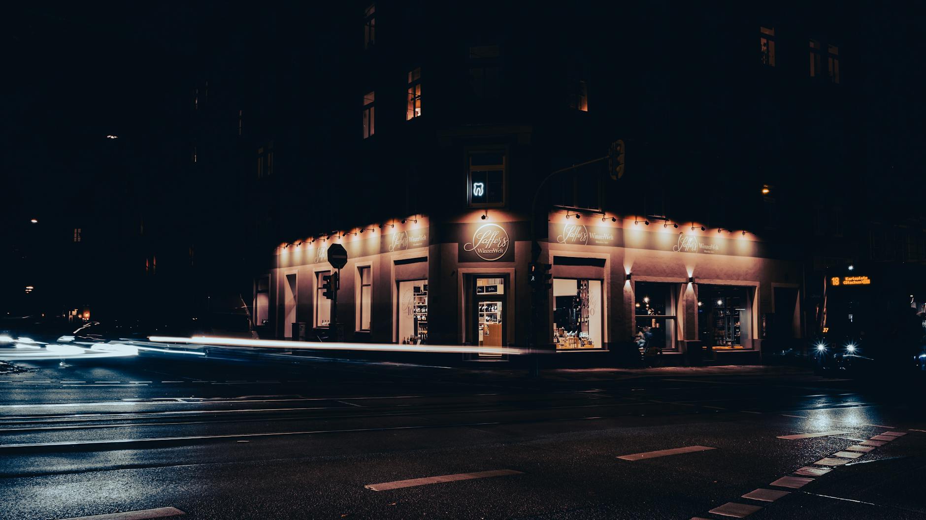 Munich street corner at night with light trails