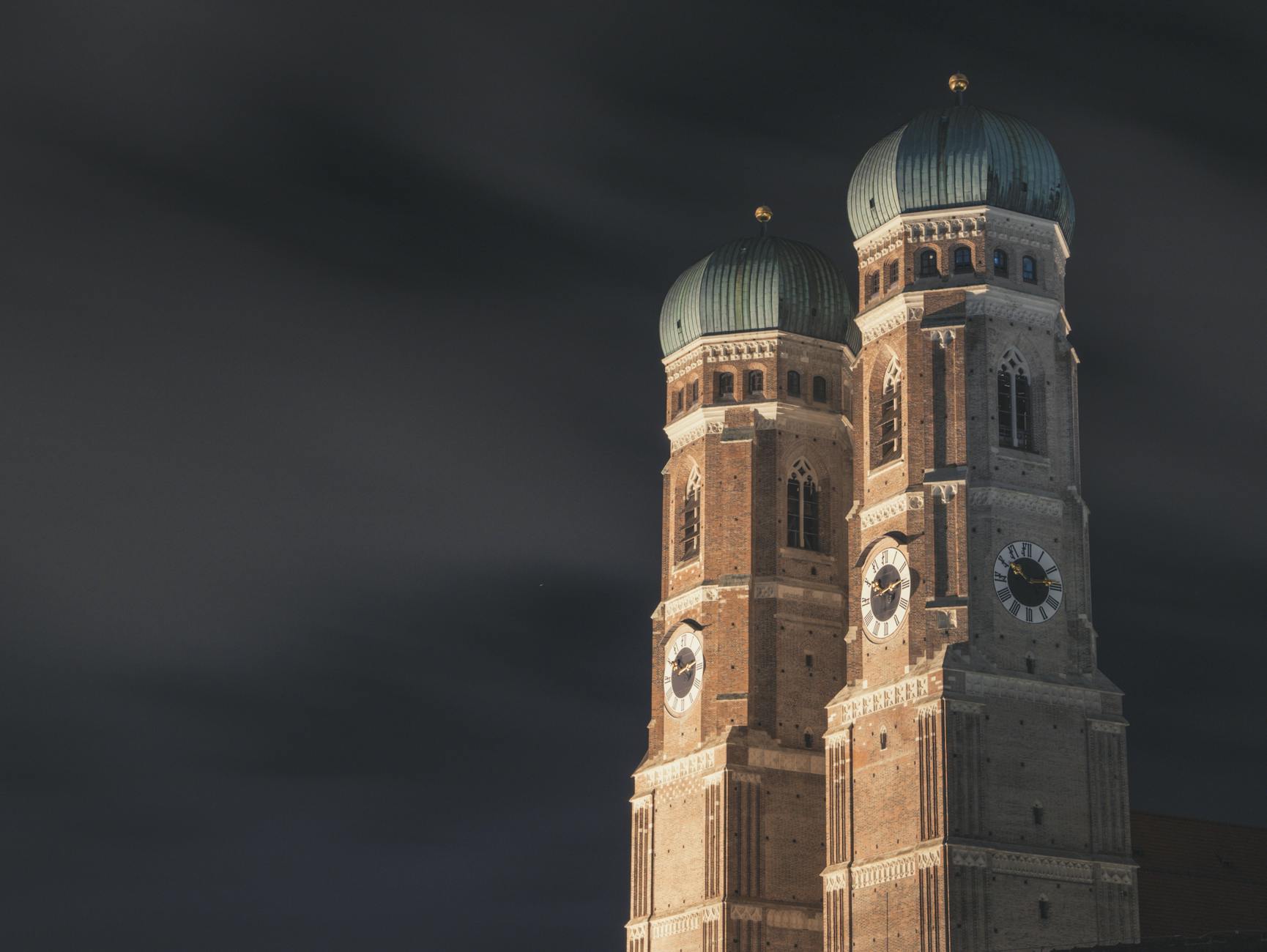Illuminated Frauenkirche towers in Munich at night