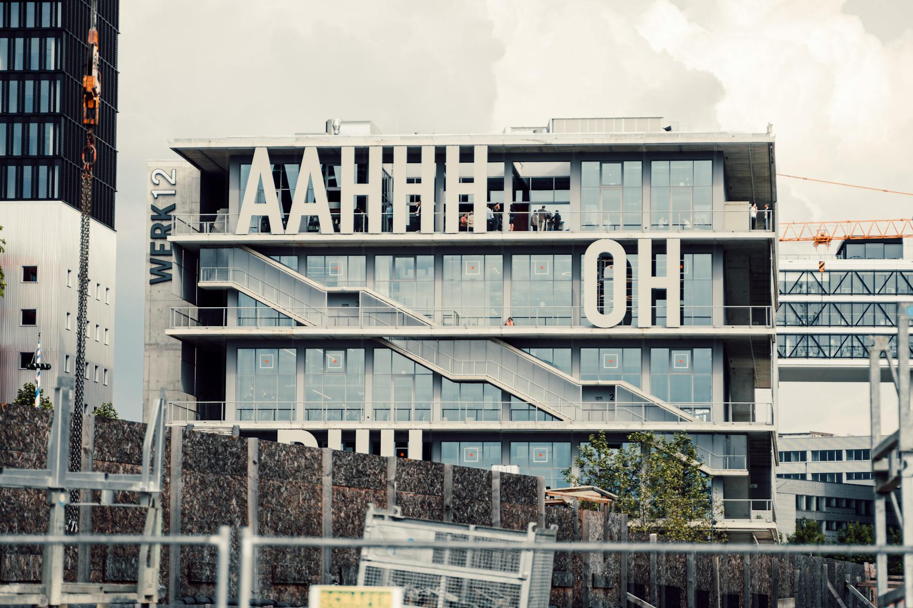 Contemporary Munich architectural facade with bold typography